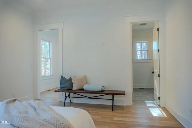 a view of a room with wooden floor
