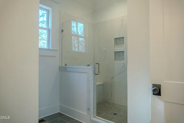 a kitchen with granite countertop a stove and a window