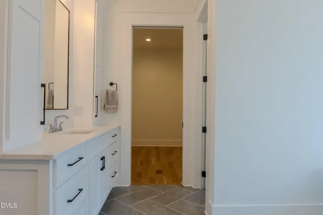 a bedroom with a bed and flat screen tv