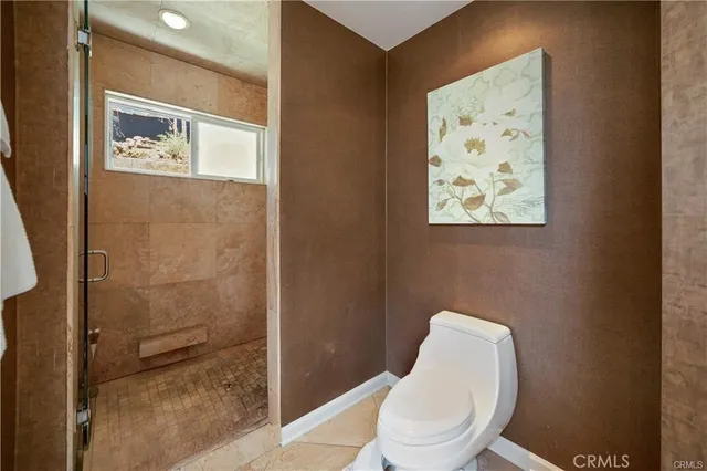 a spacious bathroom with a granite countertop sink and a mirror
