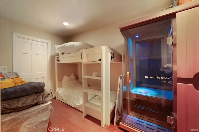 a living room with furniture a flat screen tv and a large window