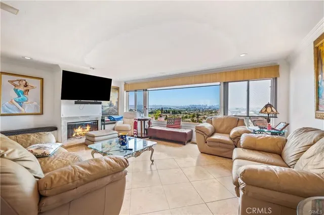a large kitchen with stainless steel appliances kitchen island granite countertop a sink and cabinets