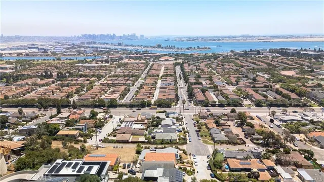 a white toilet sitting next to a shower