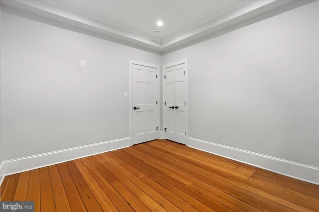 a view of bathroom with a shower and a window