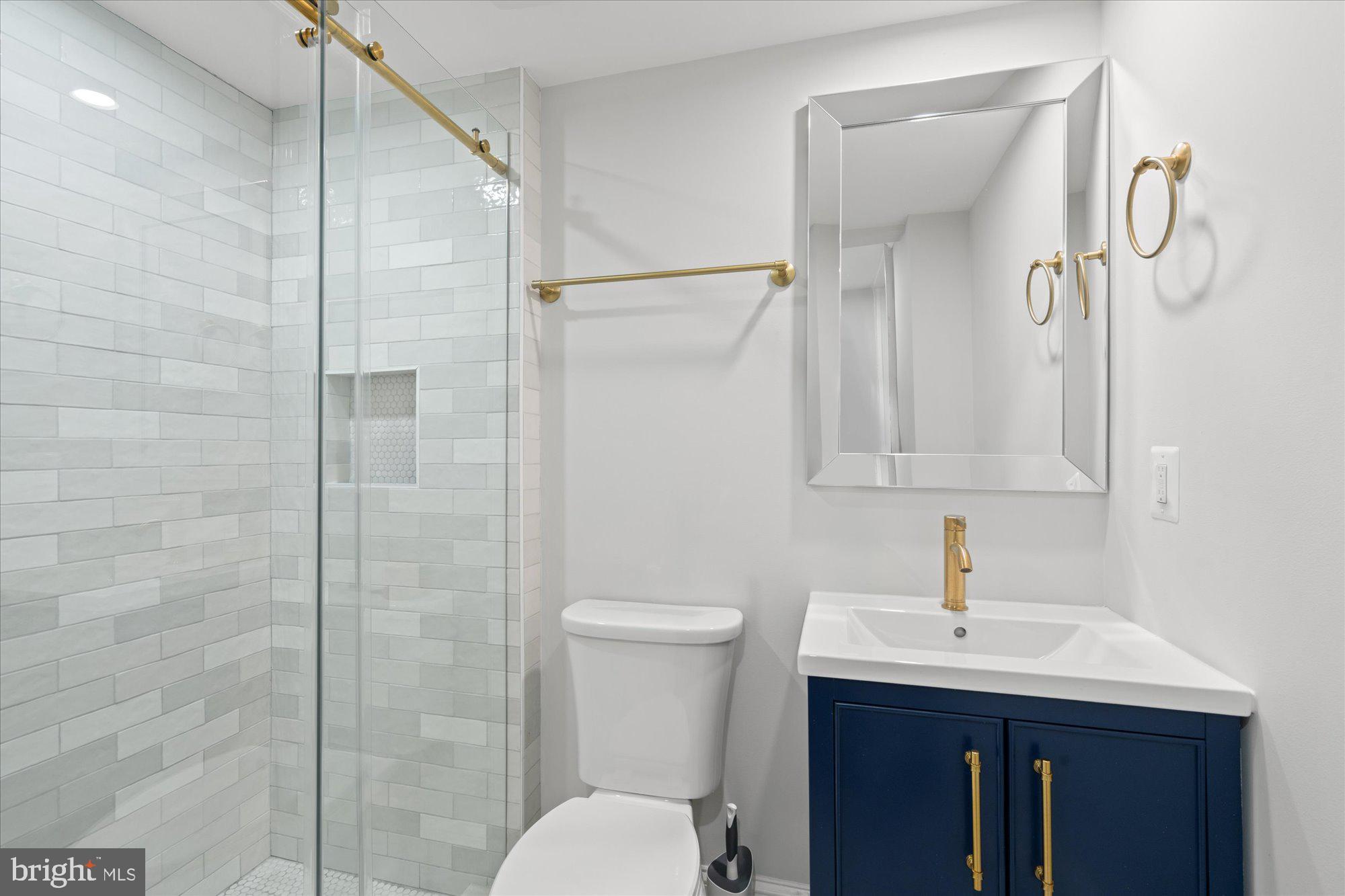 524 Queen Street Alexandria, VA 22314 - Photo 23 of 64 a bathroom with a sink a toilet and shower