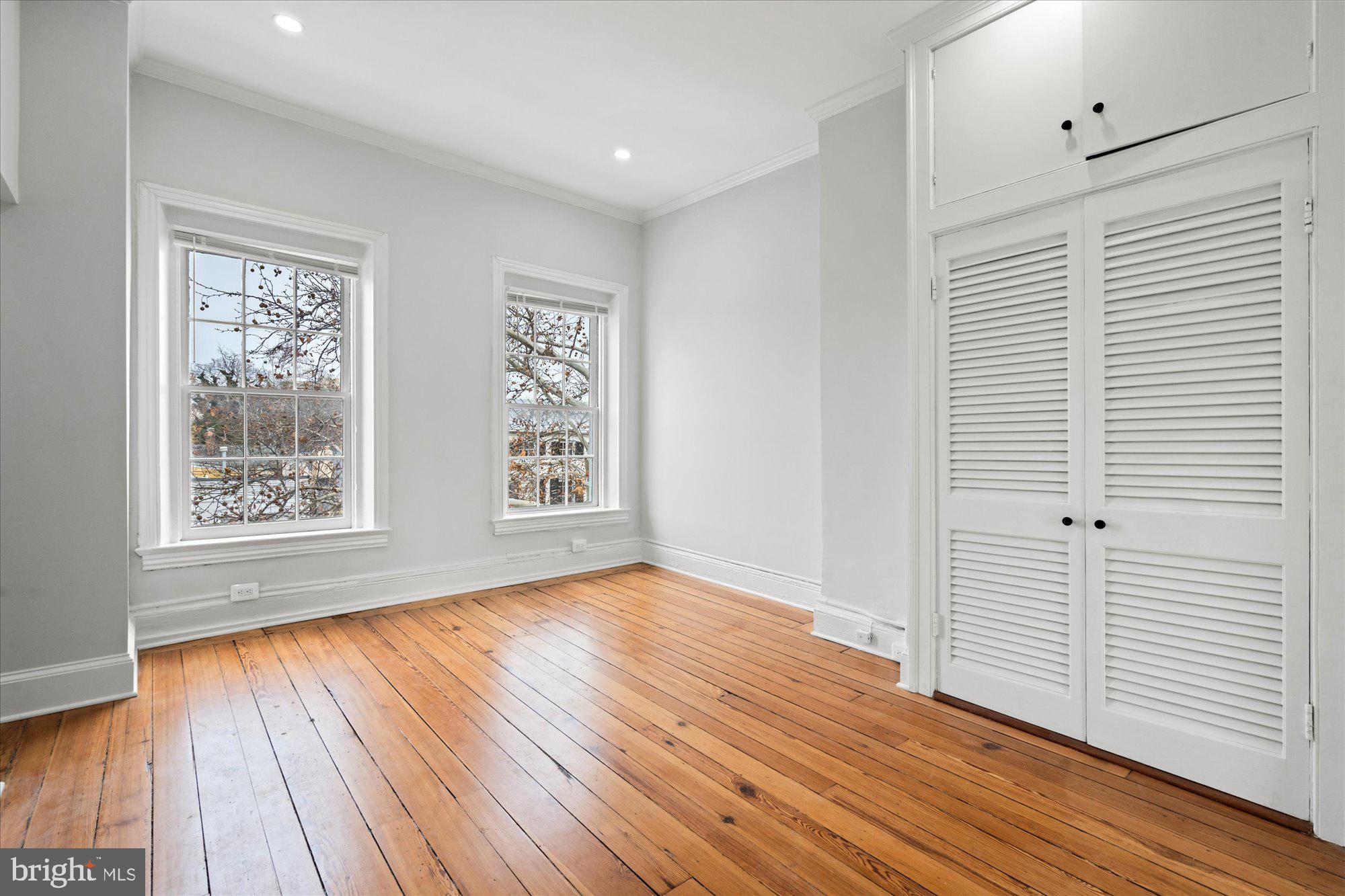 524 Queen Street Alexandria, VA 22314 - Photo 24 of 64 an empty room with wooden floor and windows