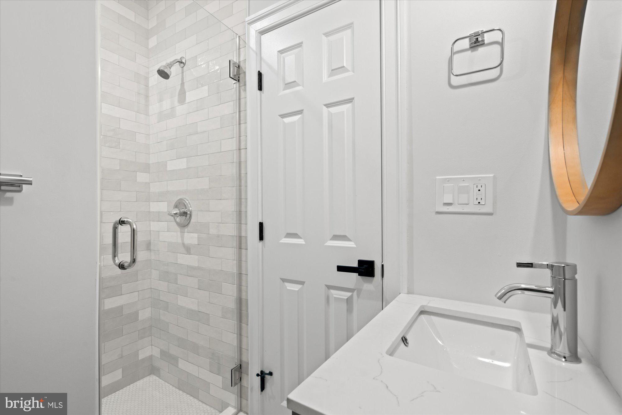 524 Queen Street Alexandria, VA 22314 - Photo 34 of 64 a bathroom with a sink a toilet and shower