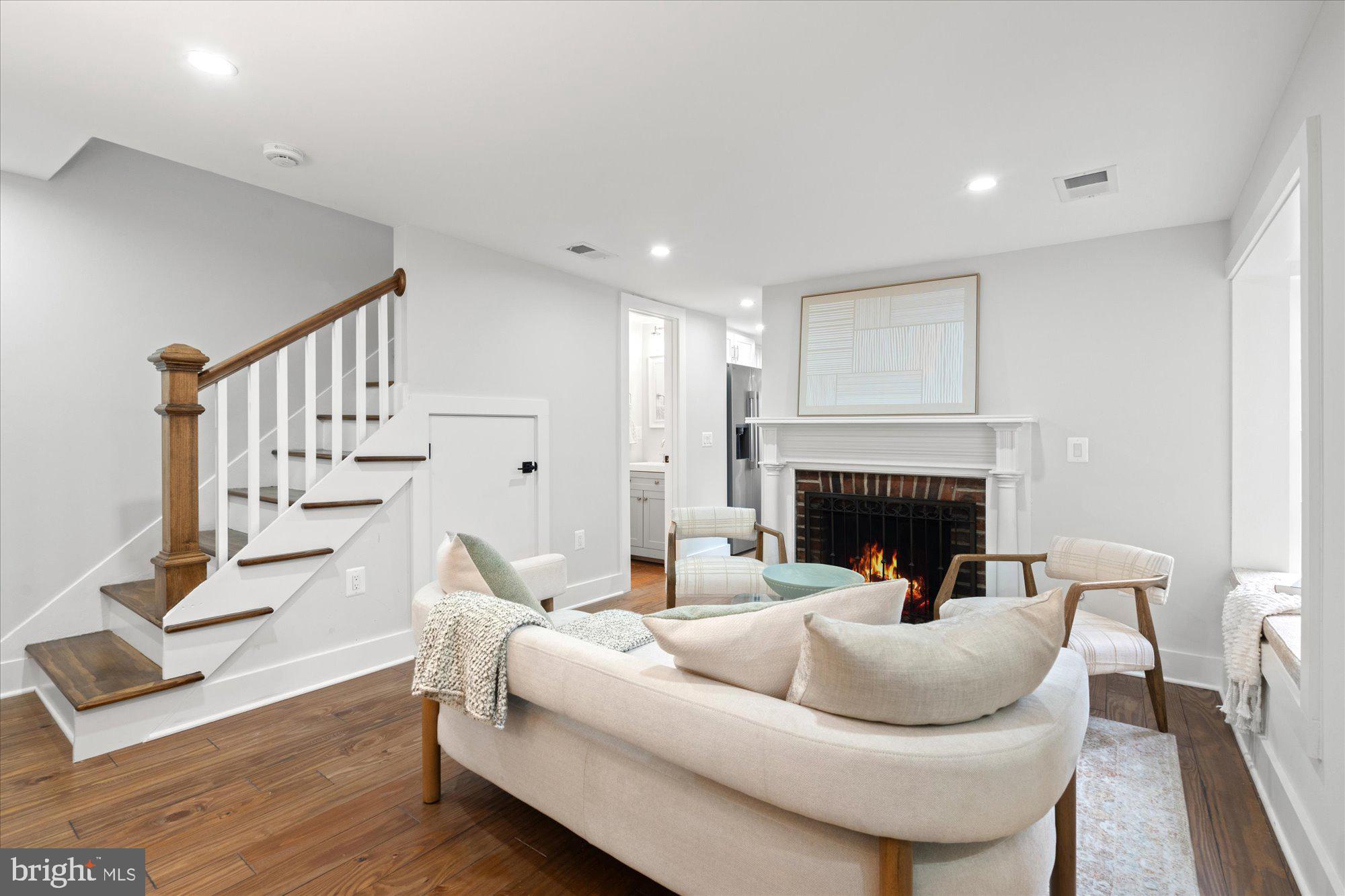 524 Queen Street Alexandria, VA 22314 - Photo 37 of 64 a living room with furniture and a fireplace