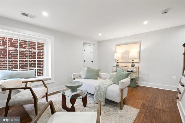 a bedroom with a bed and a night stand