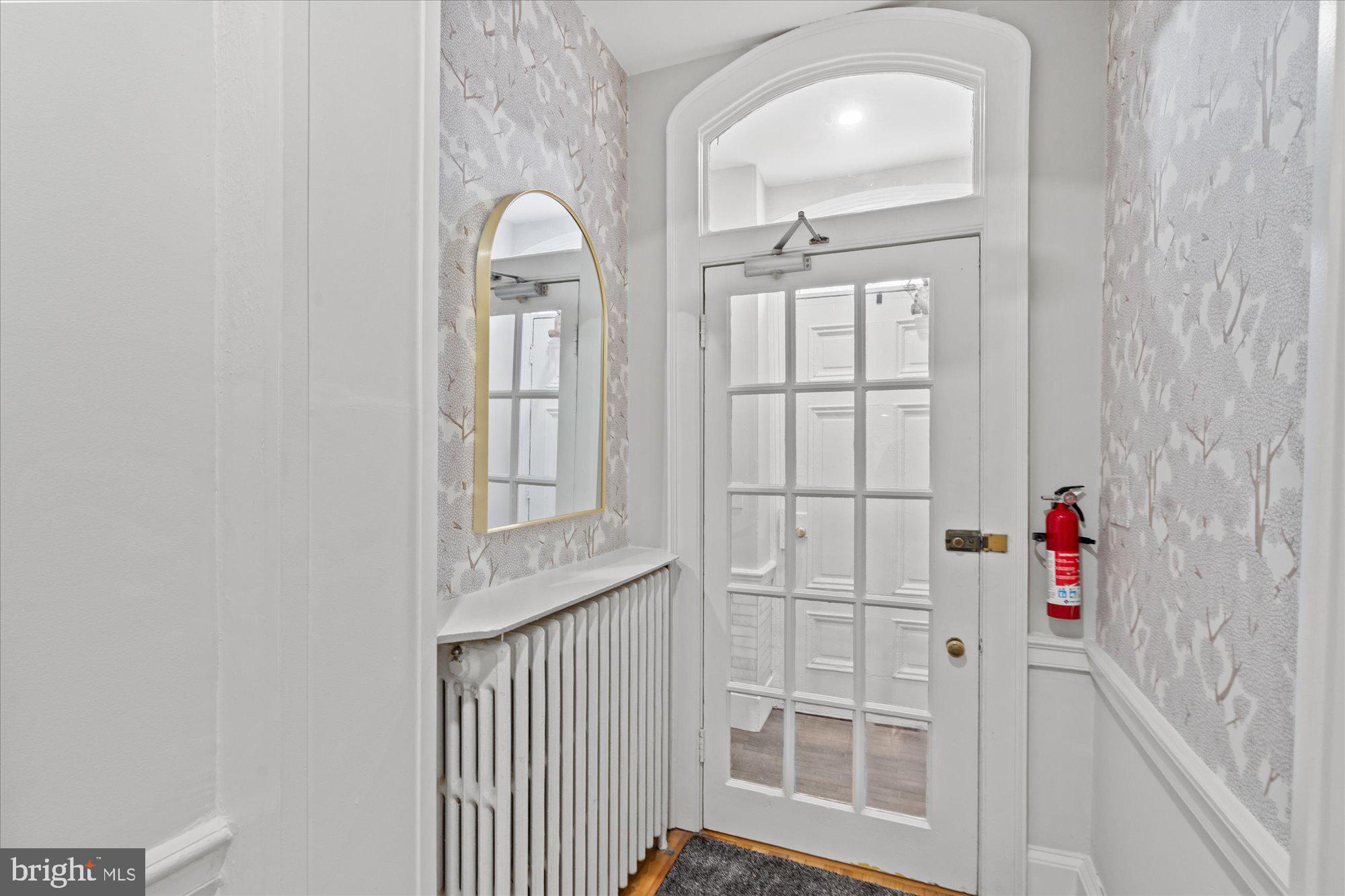 524 Queen Street Alexandria, VA 22314 - Photo 4 of 64 a view of a livingroom with wooden floor and windows