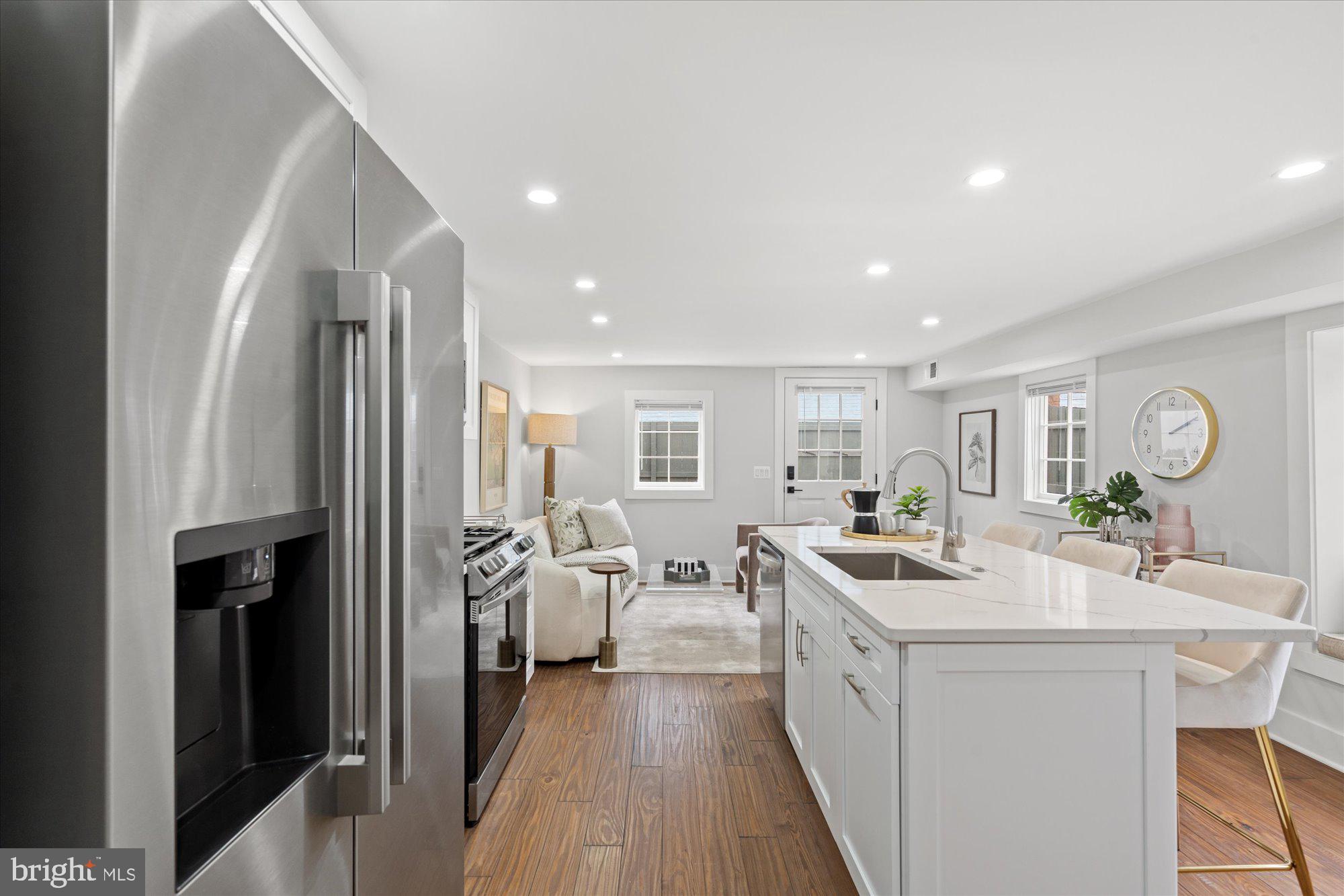 524 Queen Street Alexandria, VA 22314 - Photo 41 of 64 a kitchen with white cabinets and stainless steel appliances