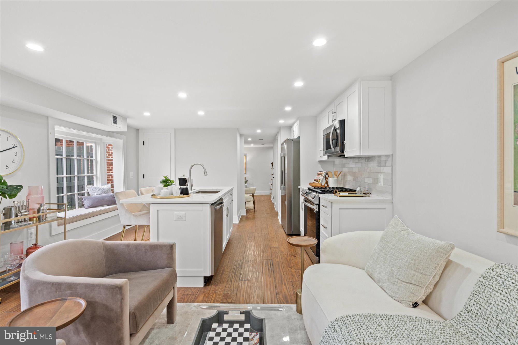 524 Queen Street Alexandria, VA 22314 - Photo 46 of 64 a living room with furniture and a view of kitchen