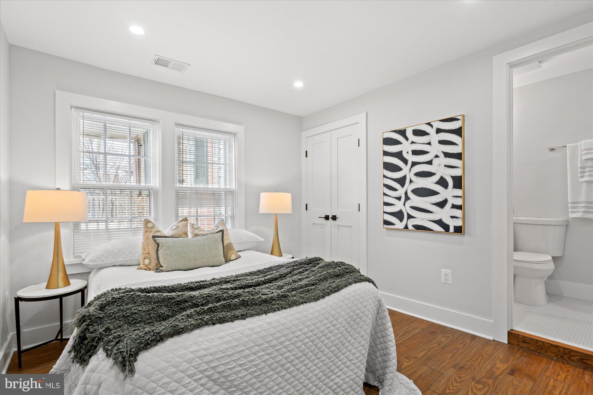 524 Queen Street Alexandria, VA 22314 - Photo 47 of 64 a bedroom with a bed and a night stand