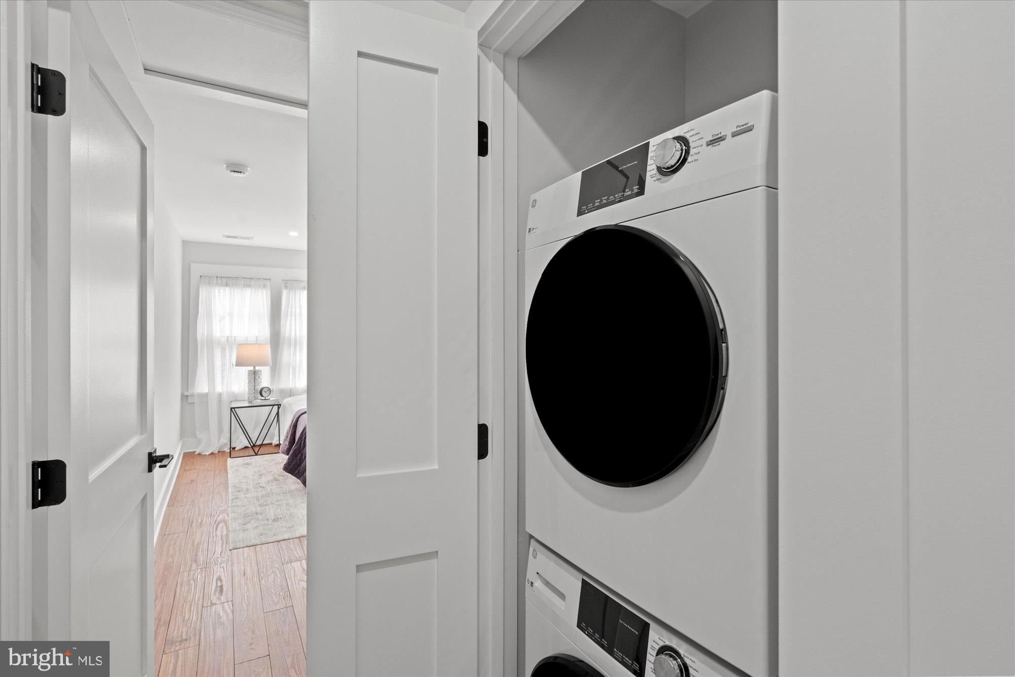 524 Queen Street Alexandria, VA 22314 - Photo 55 of 64 a view of a hallway with washer and dryer