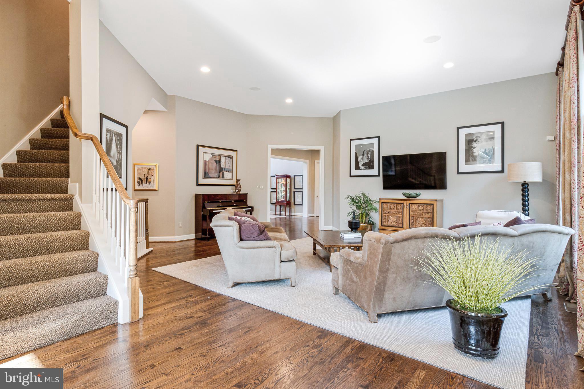 1029 Founders Ridge Lane McLean, VA 22102 - Photo 19 of 71 a living room with furniture a flat screen tv and a fireplace