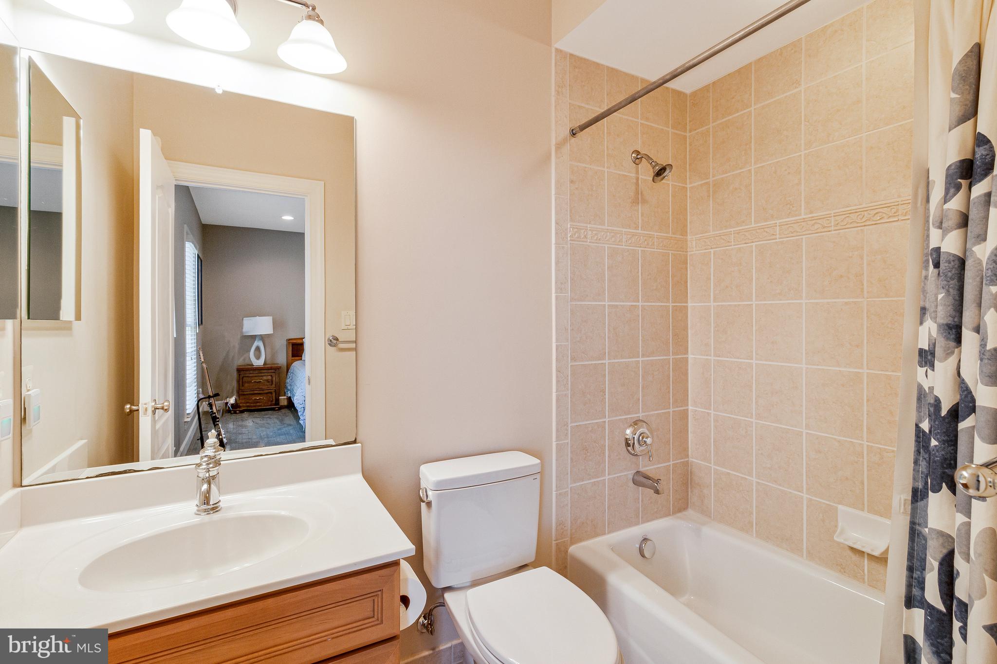1029 Founders Ridge Lane McLean, VA 22102 - Photo 40 of 71 a bathroom with a sink toilet and shower