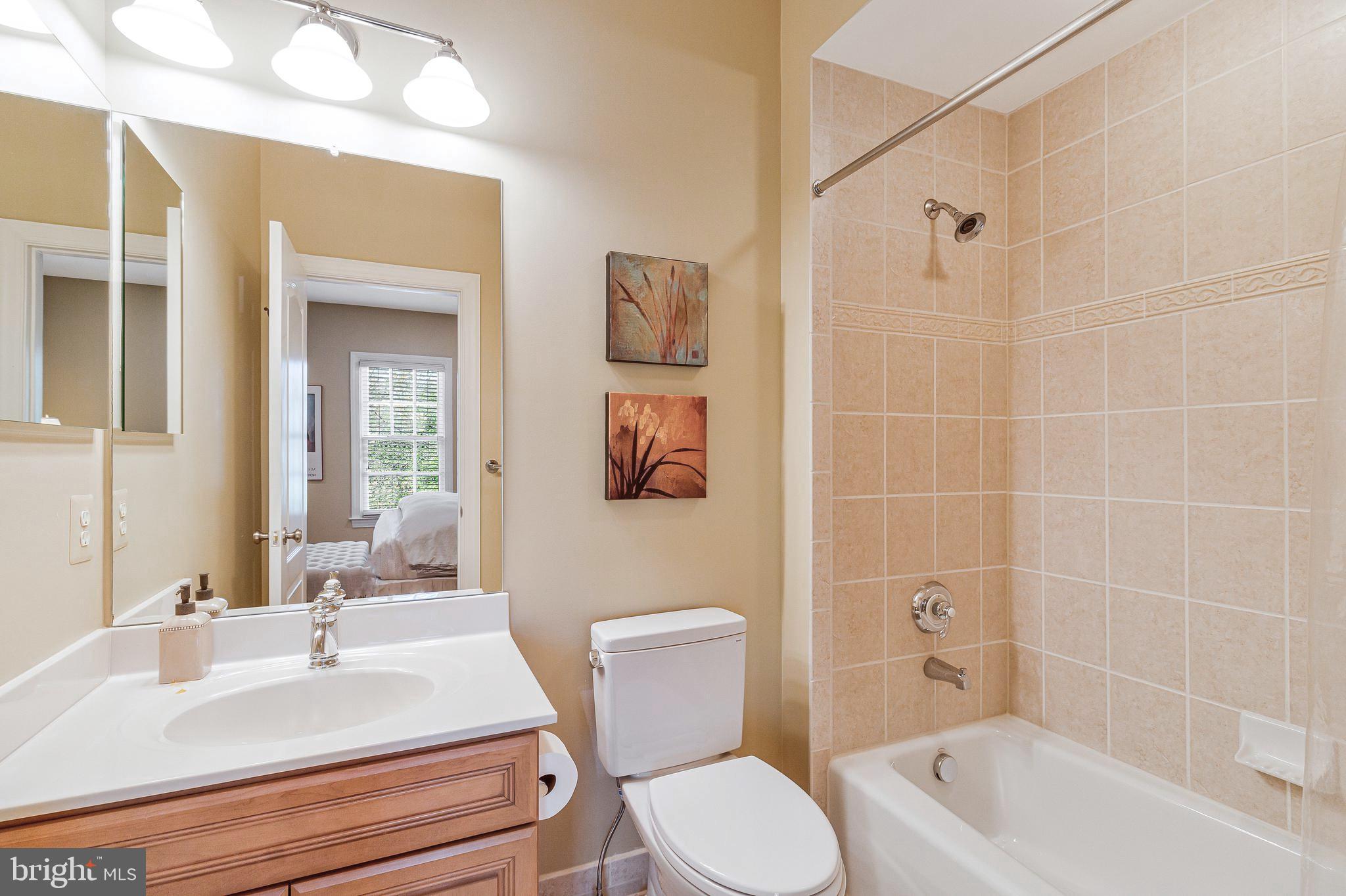 1029 Founders Ridge Lane McLean, VA 22102 - Photo 42 of 71 a bathroom with a sink toilet and shower