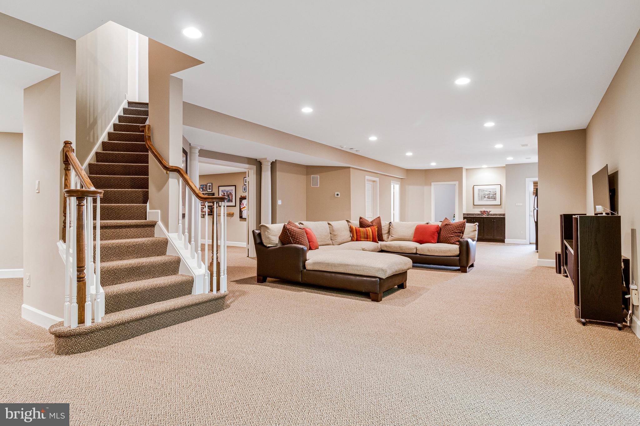 1029 Founders Ridge Lane McLean, VA 22102 - Photo 43 of 71 a living room with furniture and a chandelier