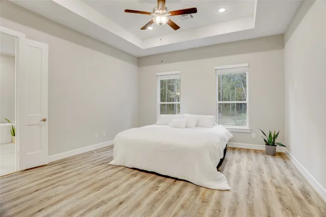 a bedroom with a bed and window