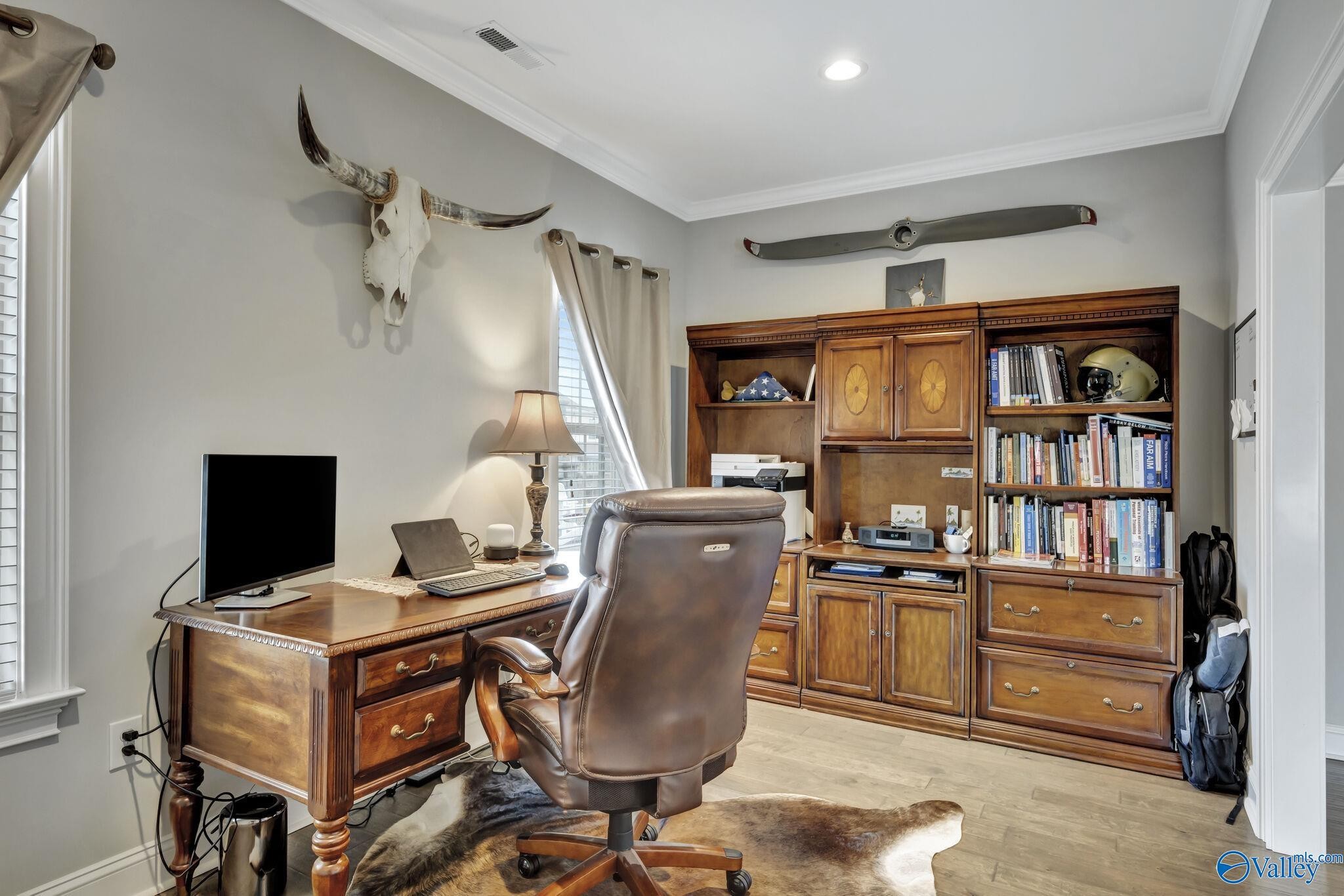 218 Southwest Winterbranch Road Madison, AL 35756 - Photo 20 of 47 a room with furniture a bookshelf and a window