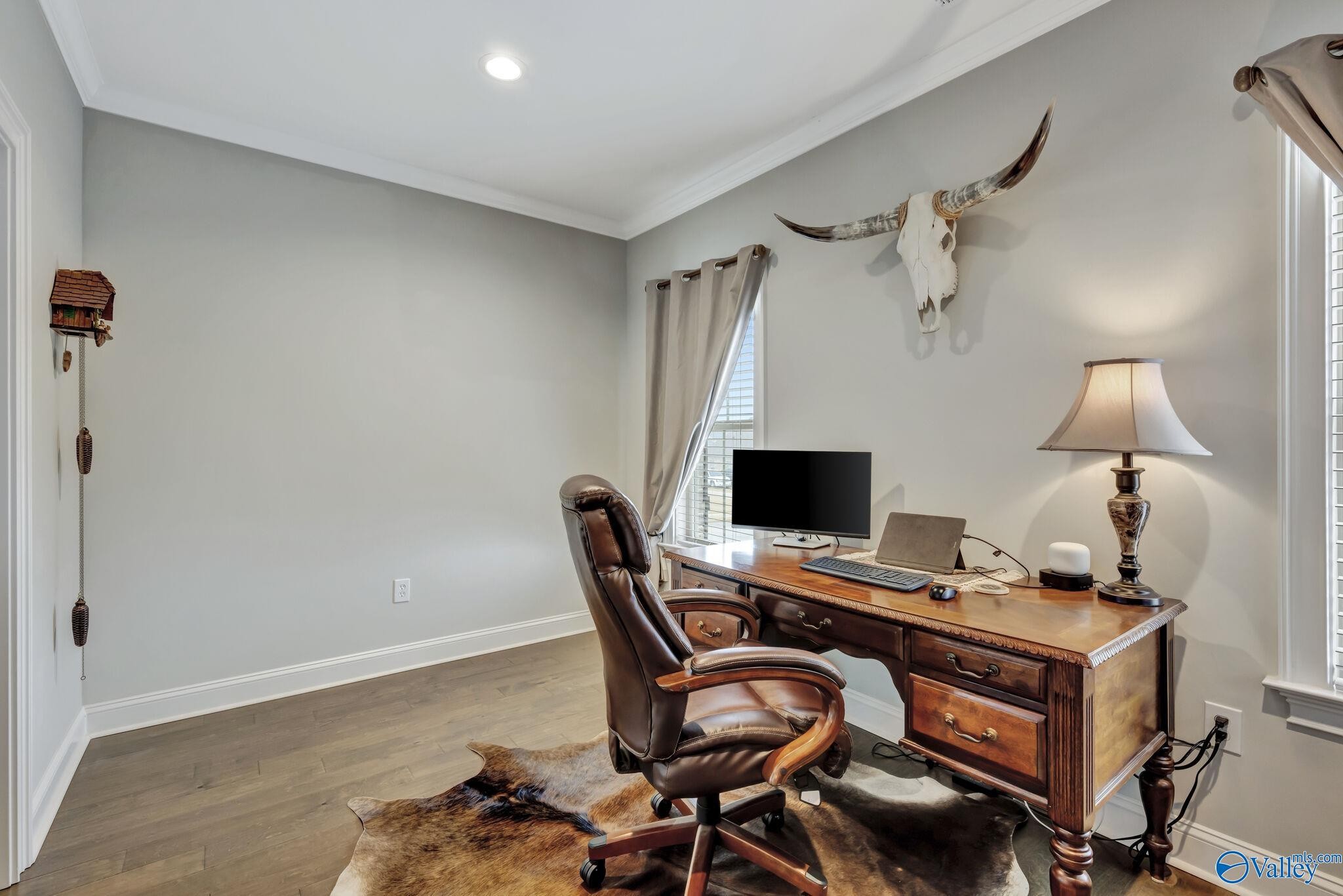 218 Southwest Winterbranch Road Madison, AL 35756 - Photo 22 of 47 a view of a workspace with furniture and a wooden floor