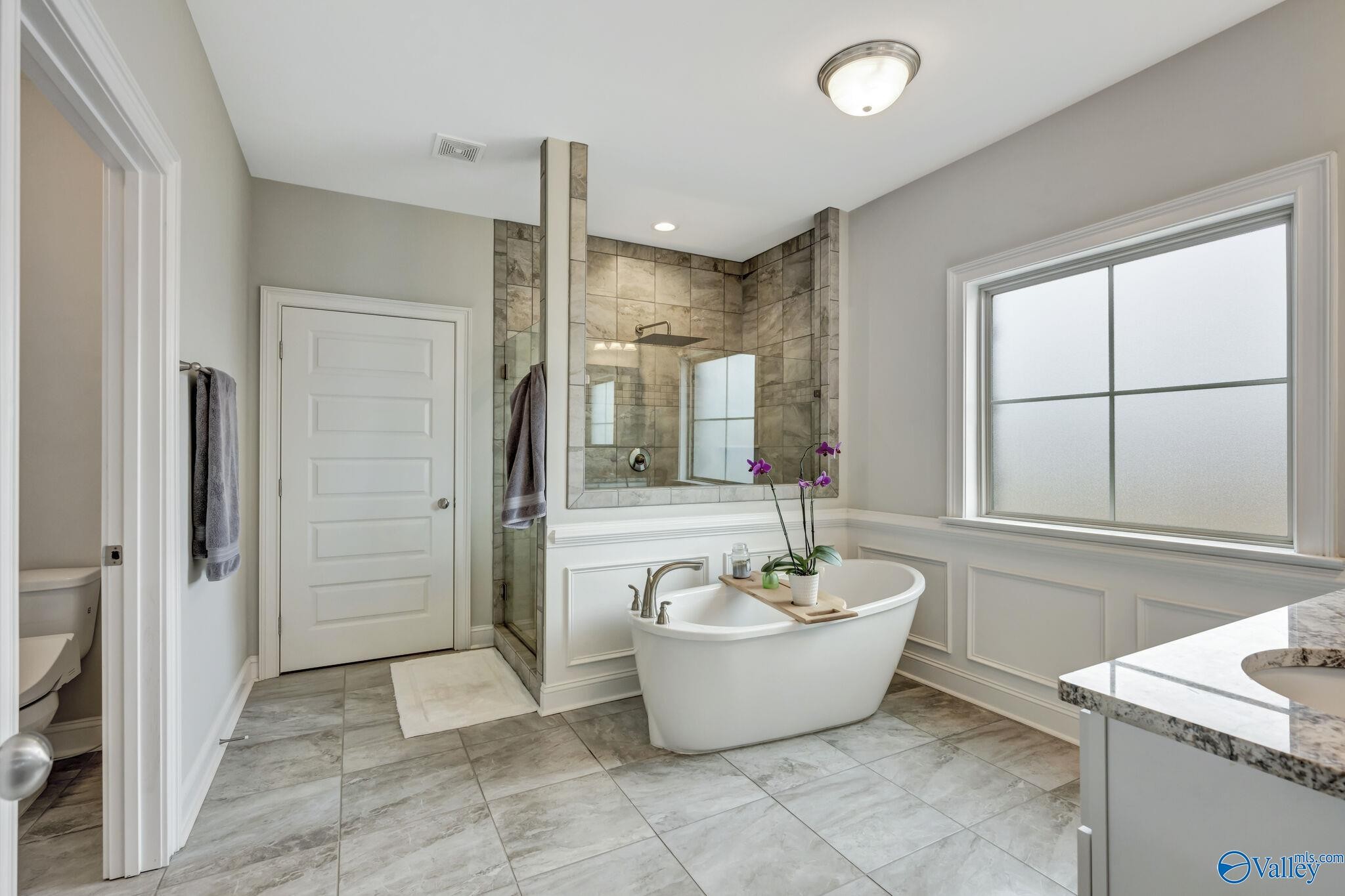 218 Southwest Winterbranch Road Madison, AL 35756 - Photo 23 of 47 a spacious bathroom with a bathtub and shower
