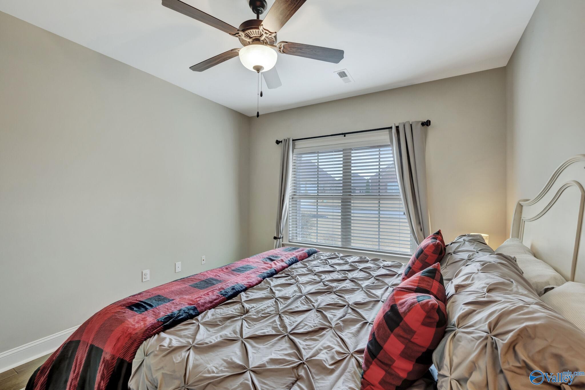 218 Southwest Winterbranch Road Madison, AL 35756 - Photo 31 of 47 a bedroom with a bed and a window