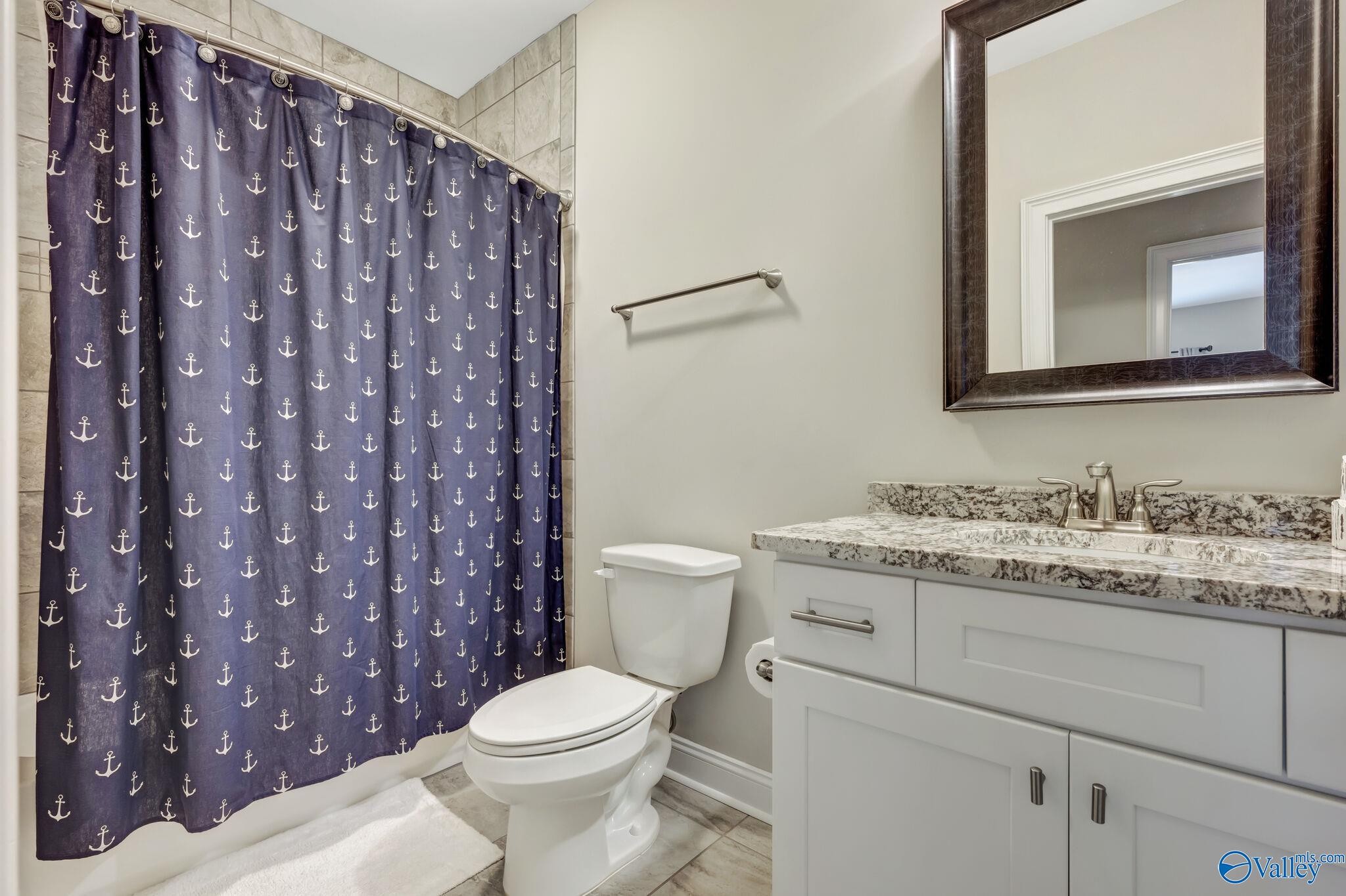 218 Southwest Winterbranch Road Madison, AL 35756 - Photo 32 of 47 a bathroom with a granite countertop toilet sink and mirror