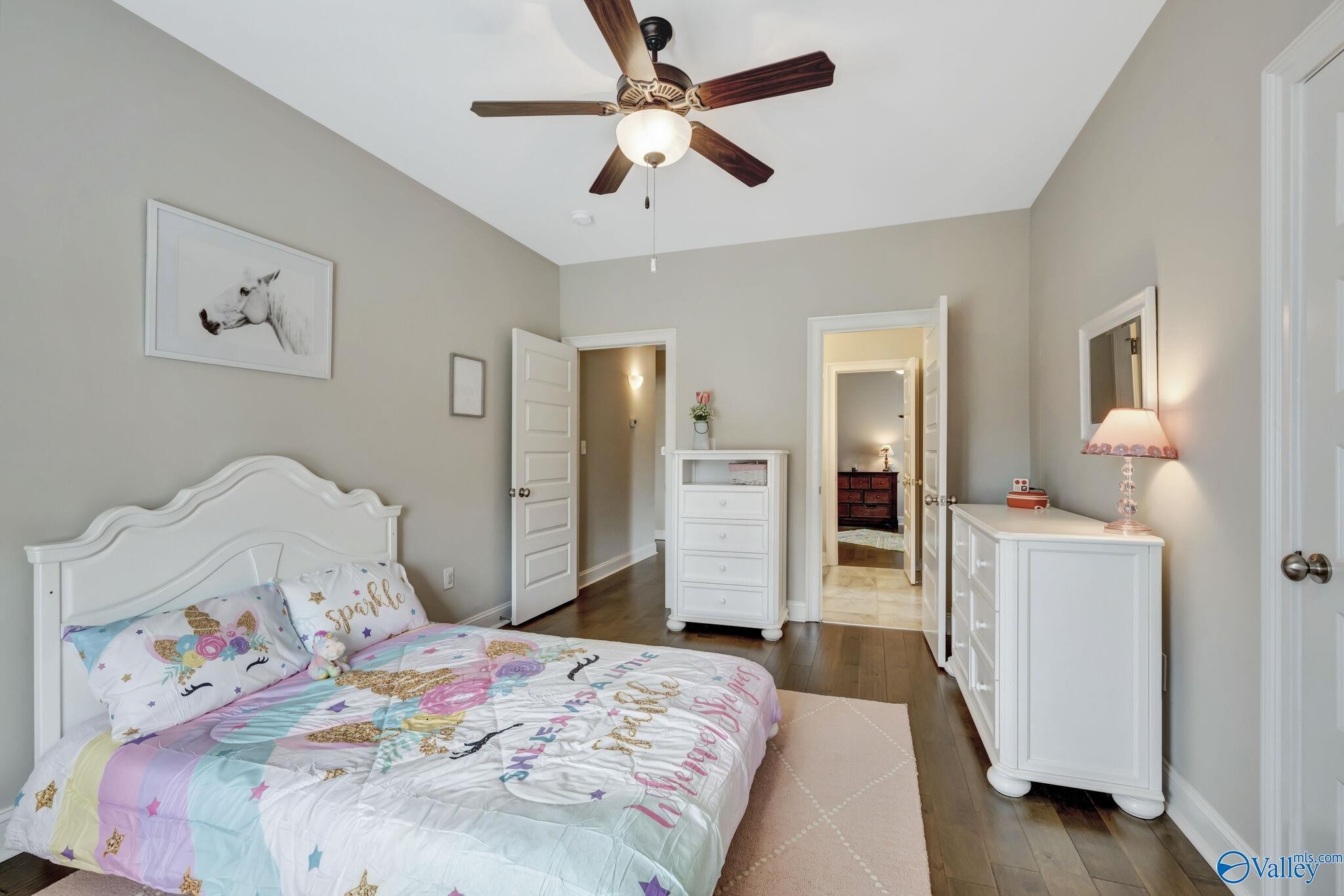 218 Southwest Winterbranch Road Madison, AL 35756 - Photo 38 of 47 a bedroom with a bed and wooden floor