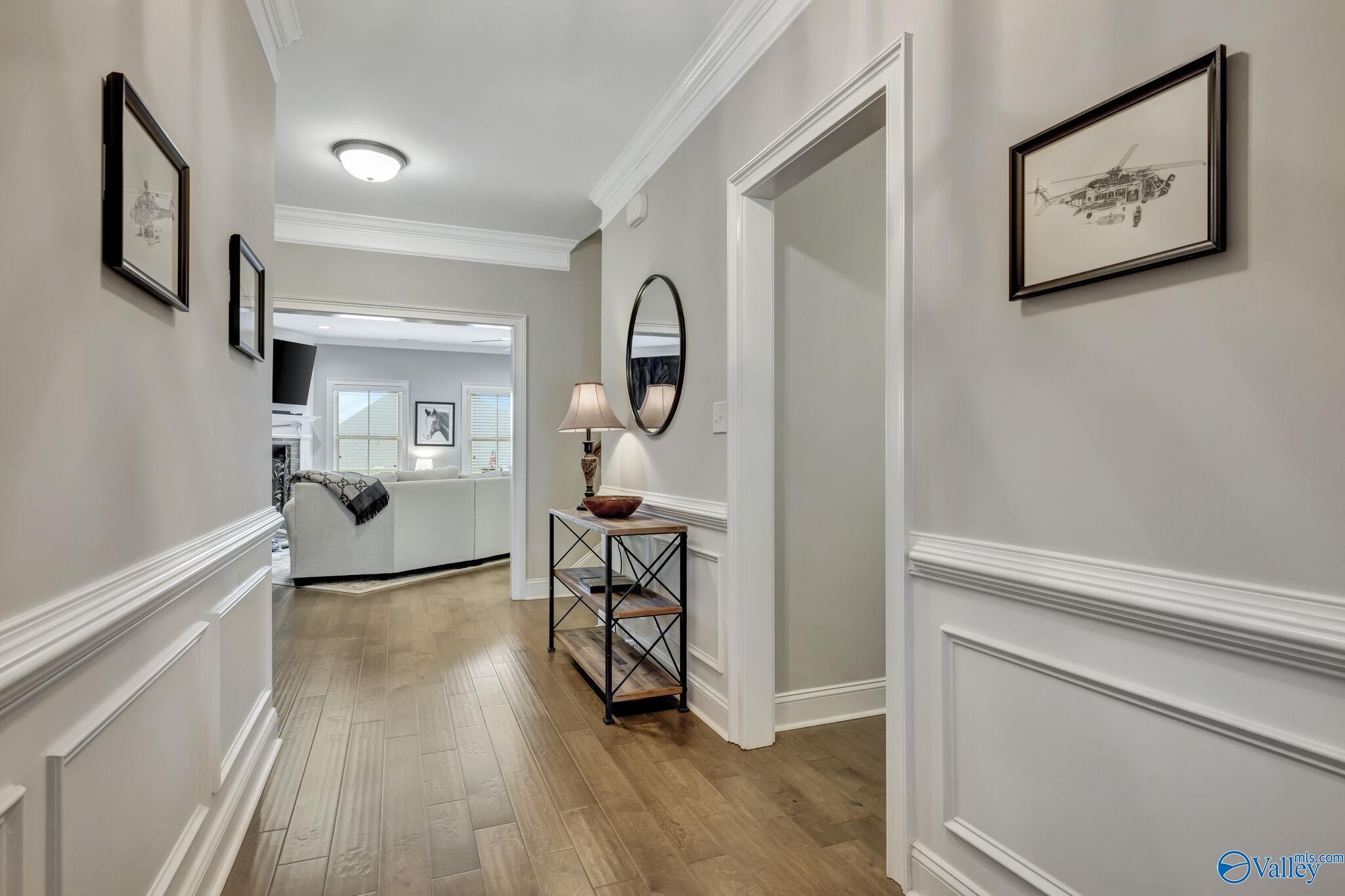 218 Southwest Winterbranch Road Madison, AL 35756 - Photo 5 of 47 a view of a hallway with wooden floor and furniture