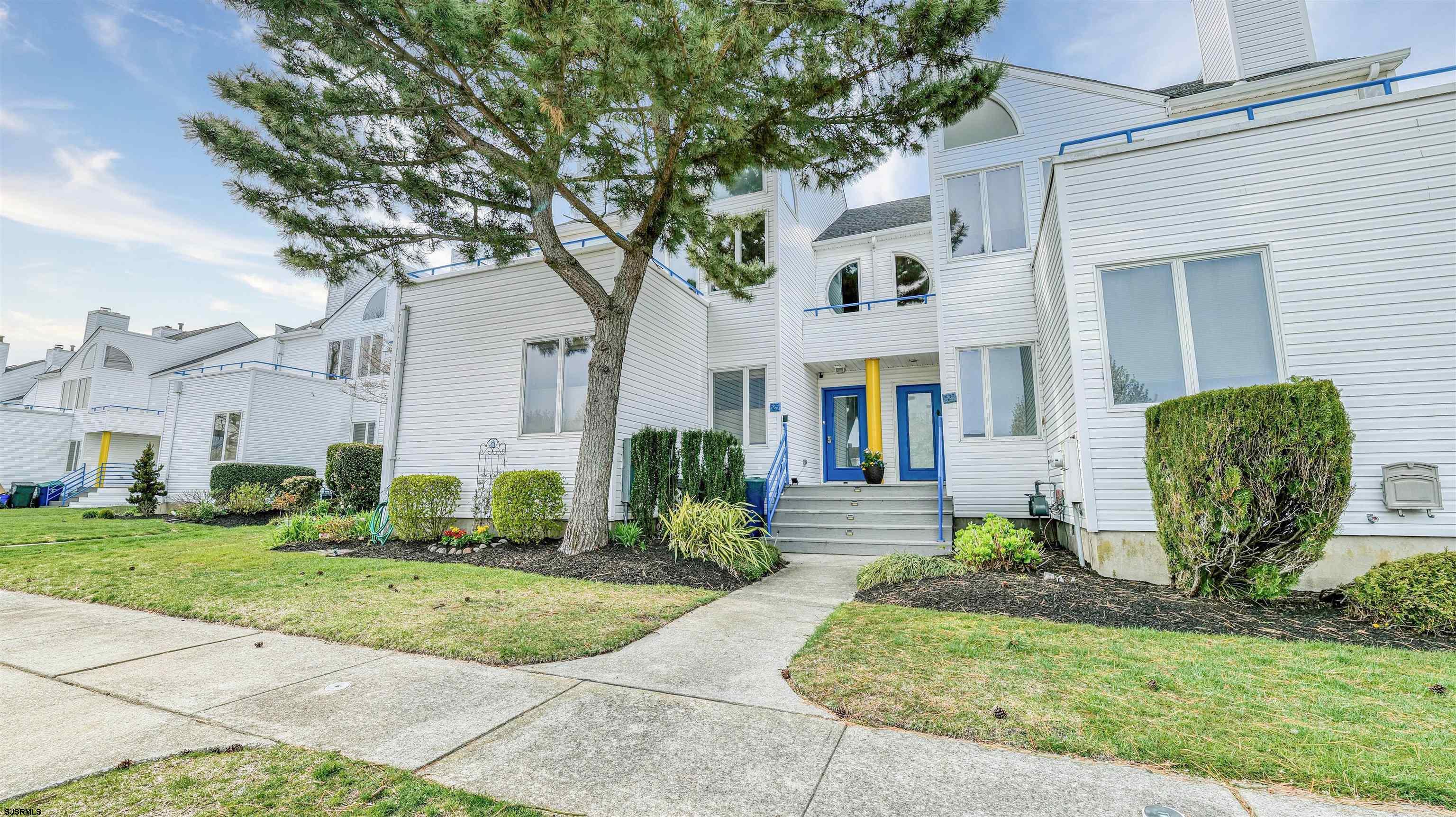 525 Lagoon Boulevard Brigantine, NJ 08203 - Photo 12 of 52 a front view of a house with garden