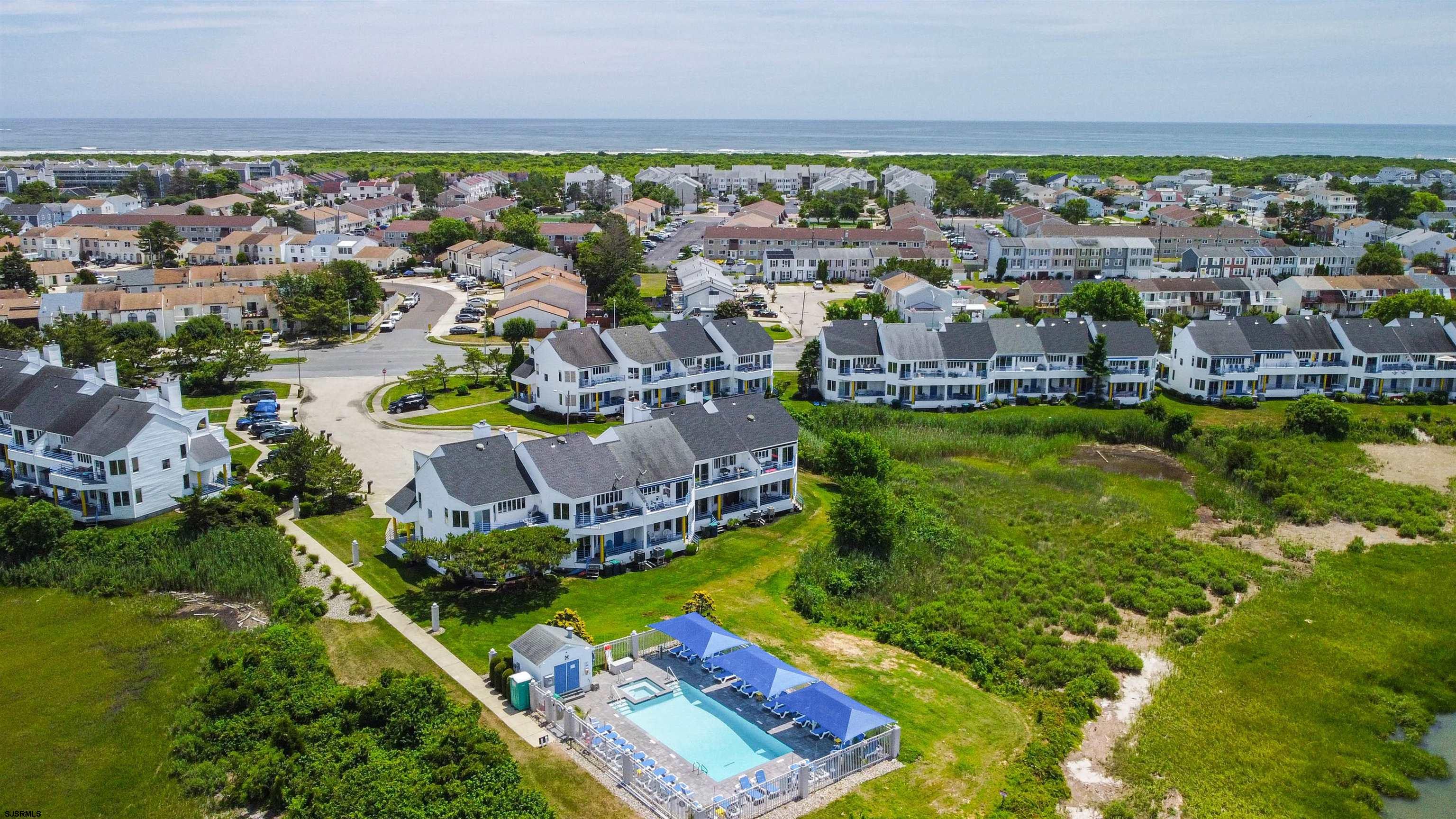 525 Lagoon Boulevard Brigantine, NJ 08203 - Photo 2 of 52 an aerial view of a house with a garden