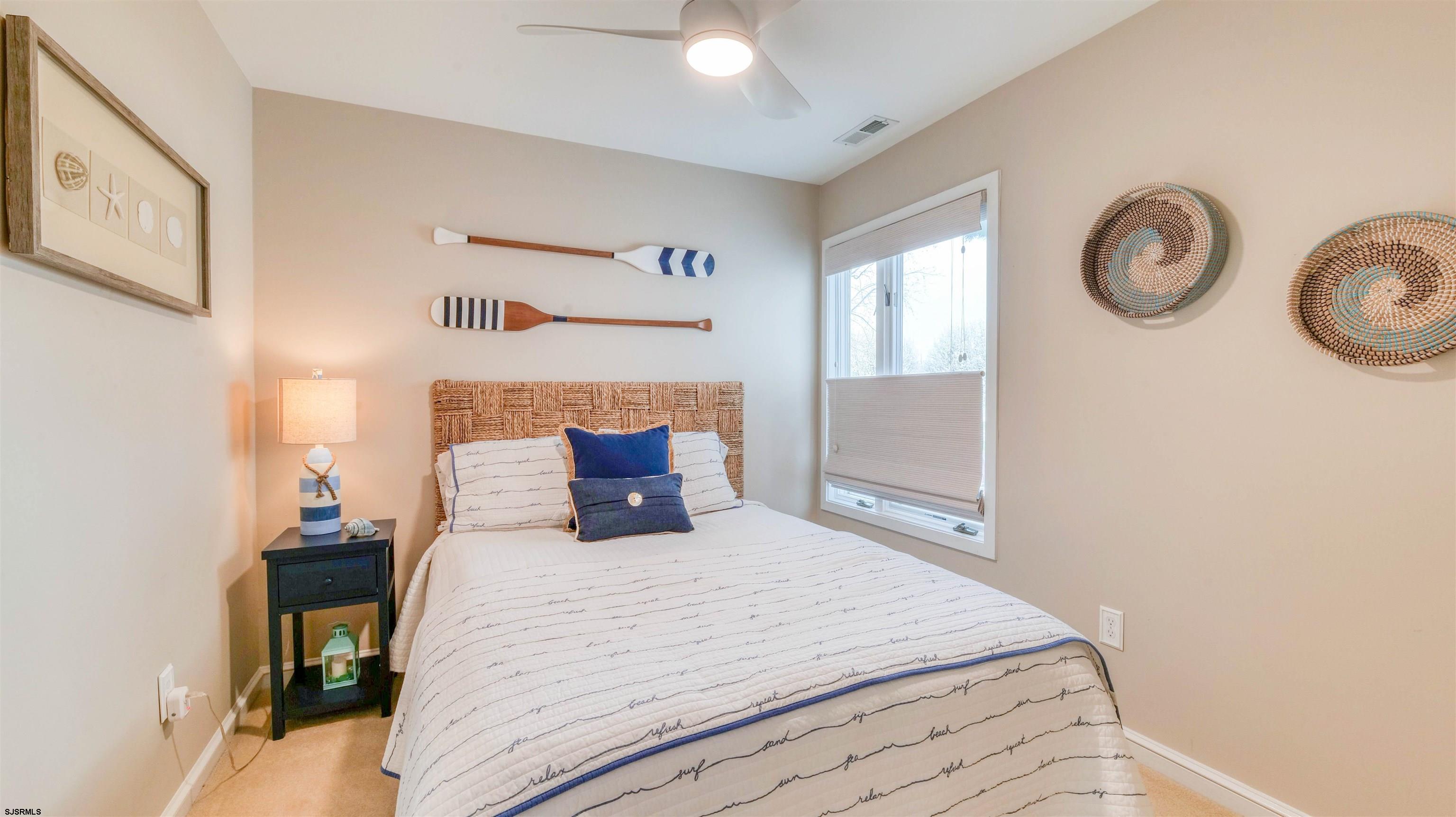 525 Lagoon Boulevard Brigantine, NJ 08203 - Photo 25 of 52 a bedroom with a bed and a closet