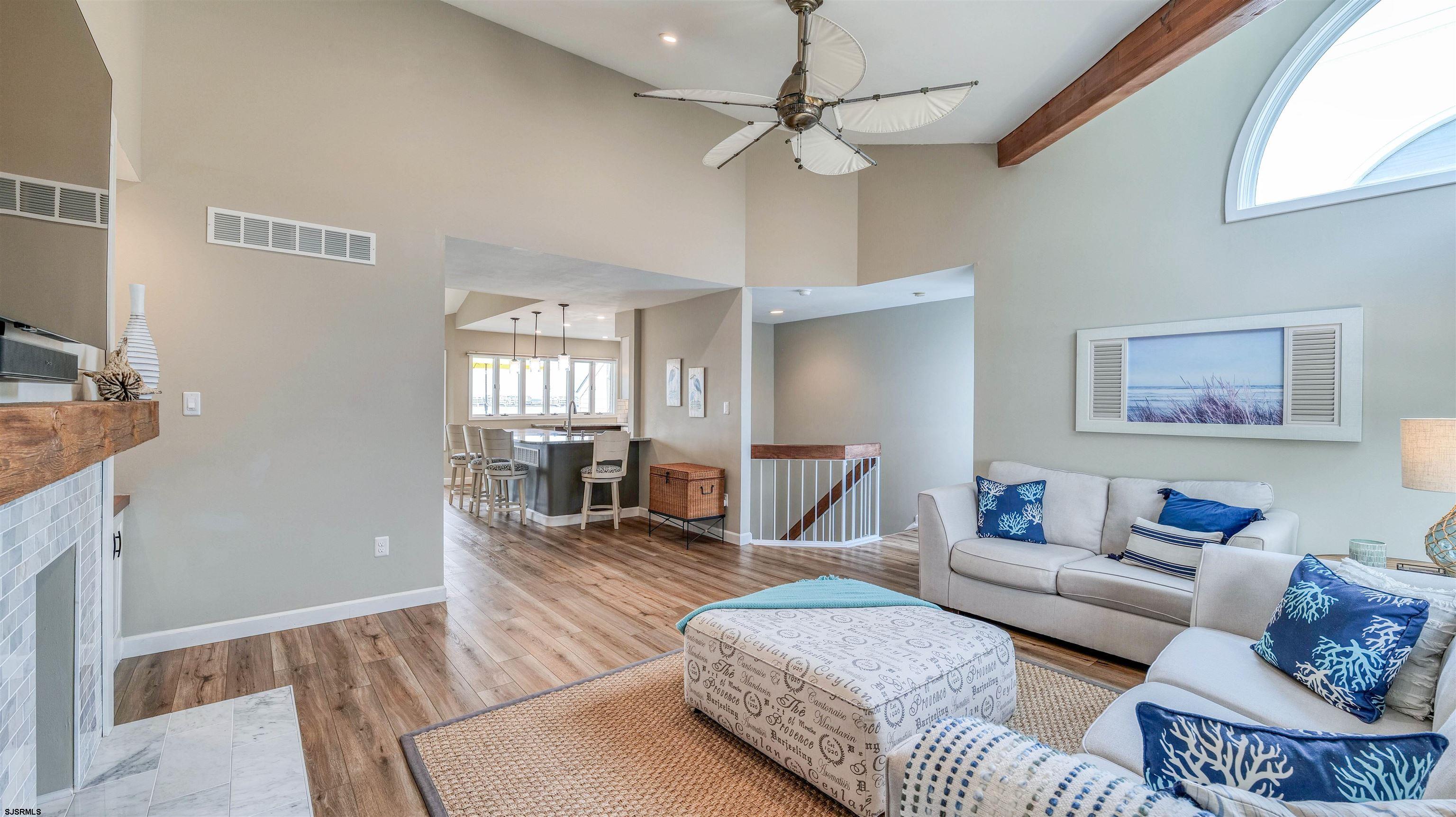 525 Lagoon Boulevard Brigantine, NJ 08203 - Photo 31 of 52 a living room with furniture and a wooden floor