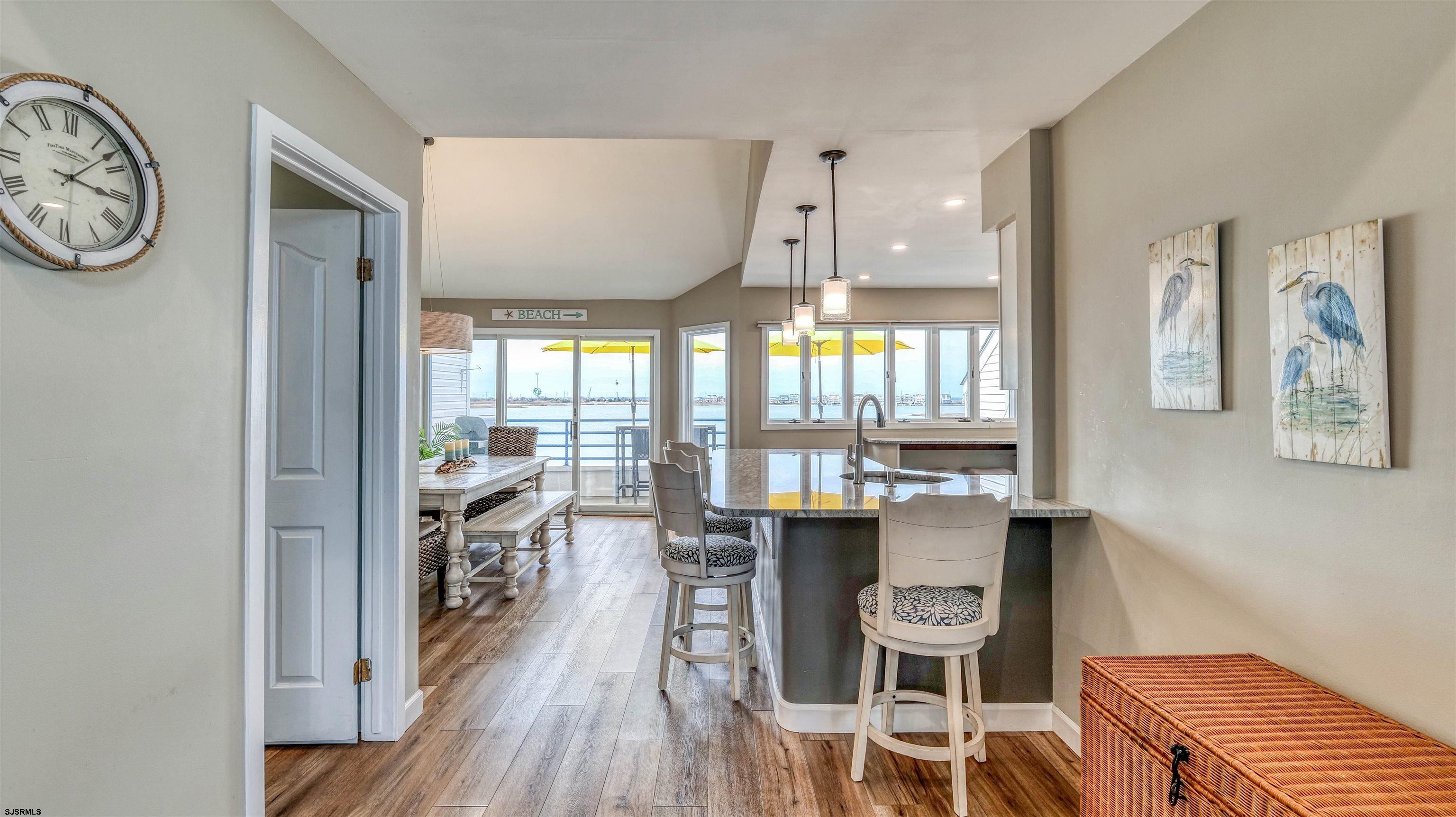 525 Lagoon Boulevard Brigantine, NJ 08203 - Photo 33 of 52 a view of a dining room with furniture window and wooden floor