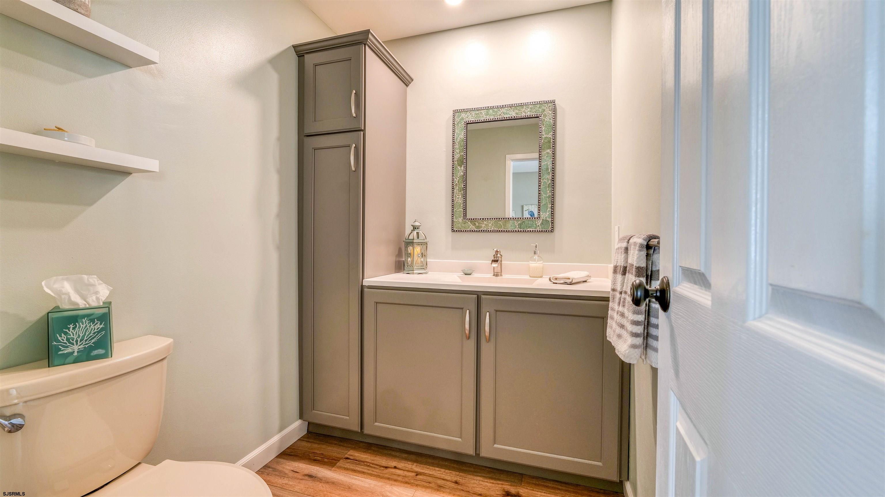 525 Lagoon Boulevard Brigantine, NJ 08203 - Photo 34 of 52 a bathroom with a sink a toilet and shower