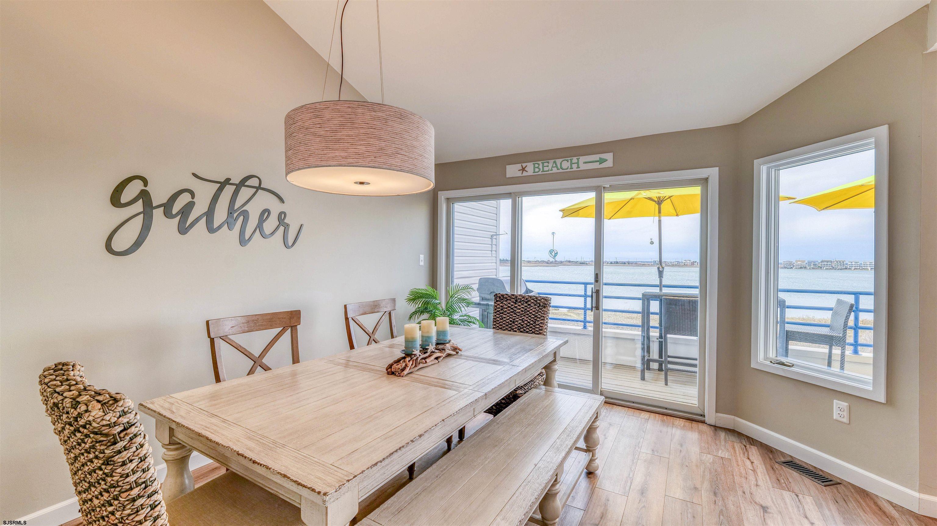 525 Lagoon Boulevard Brigantine, NJ 08203 - Photo 36 of 52 a living room with furniture and a large window