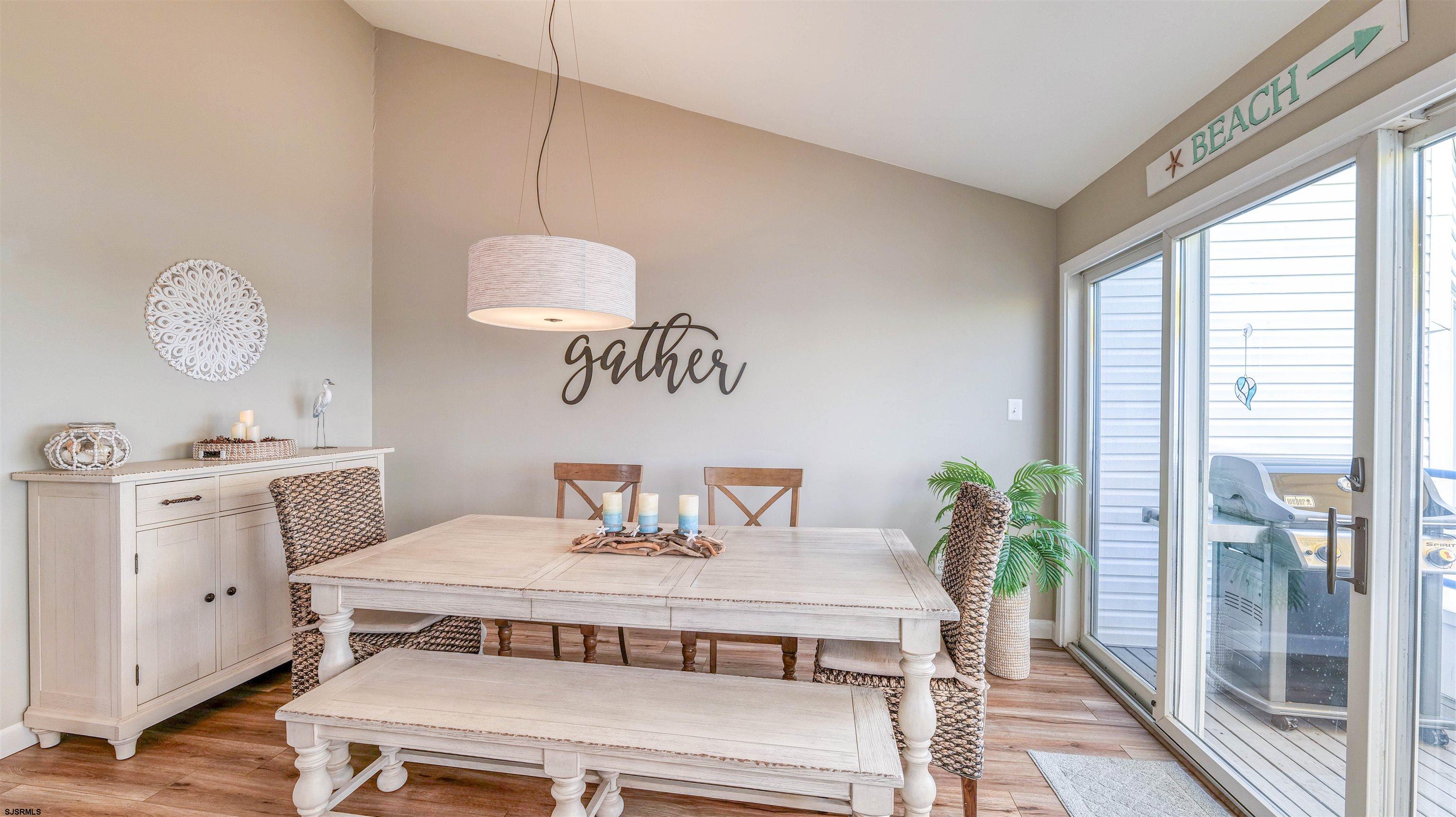 525 Lagoon Boulevard Brigantine, NJ 08203 - Photo 39 of 52 a dining room with a table and chairs