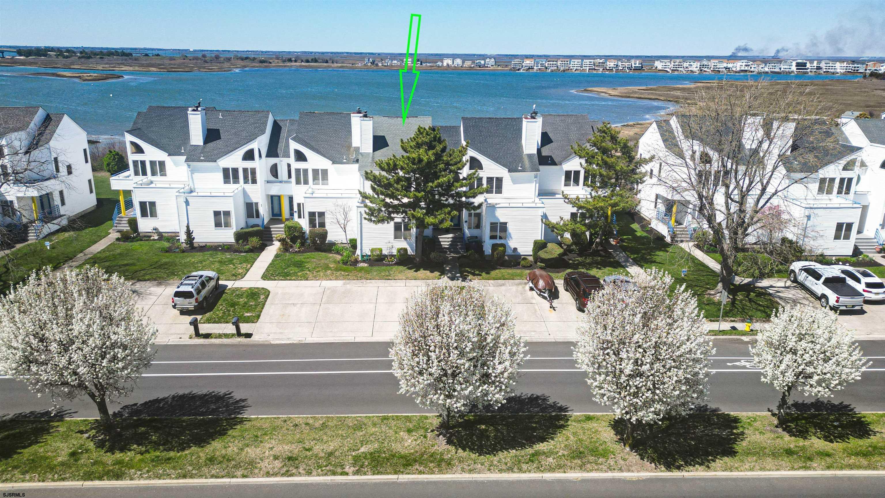 525 Lagoon Boulevard Brigantine, NJ 08203 - Photo 4 of 52 a view of a house with a yard