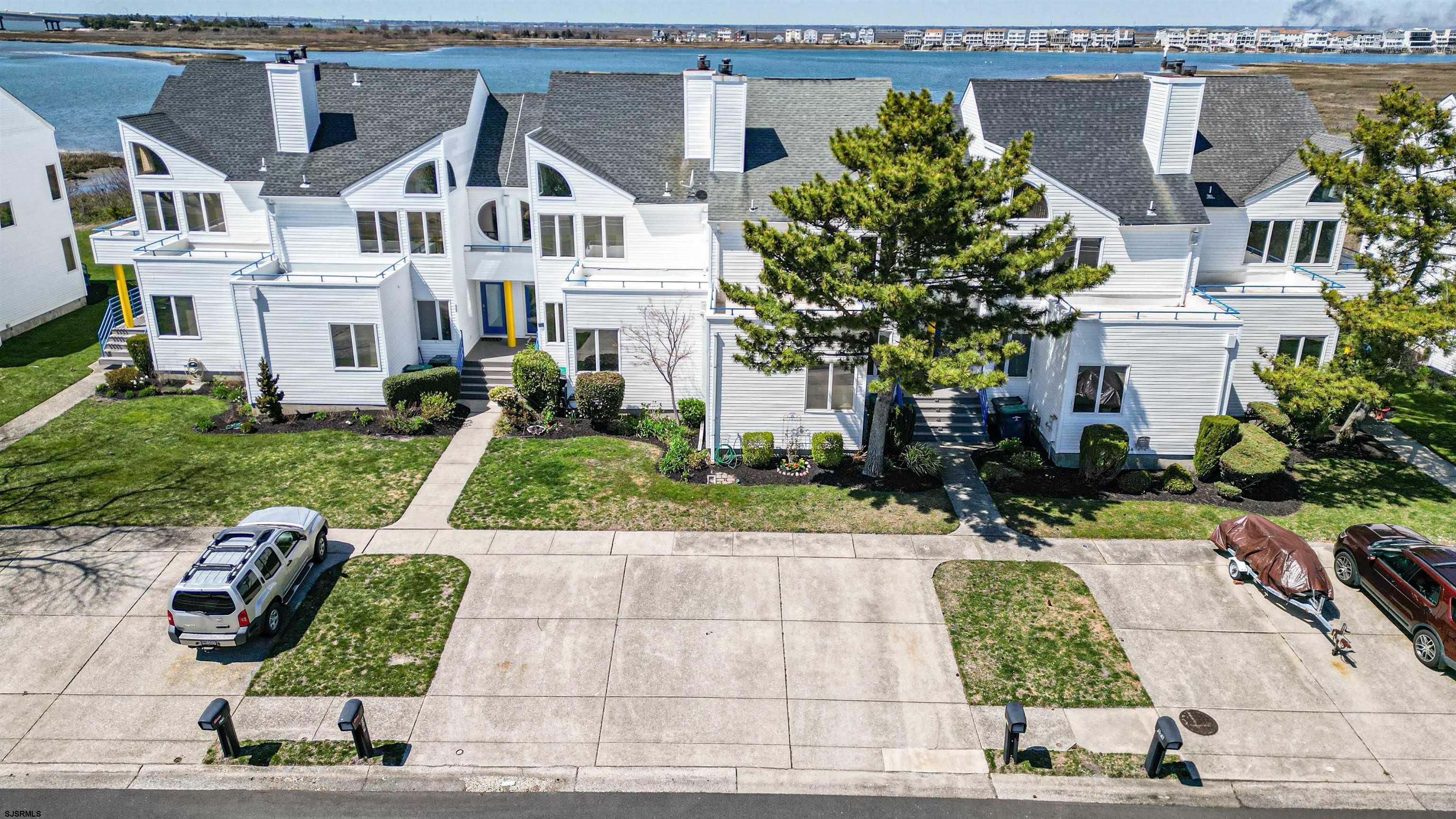 525 Lagoon Boulevard Brigantine, NJ 08203 - Photo 8 of 52 a house with lots of trees in front of it