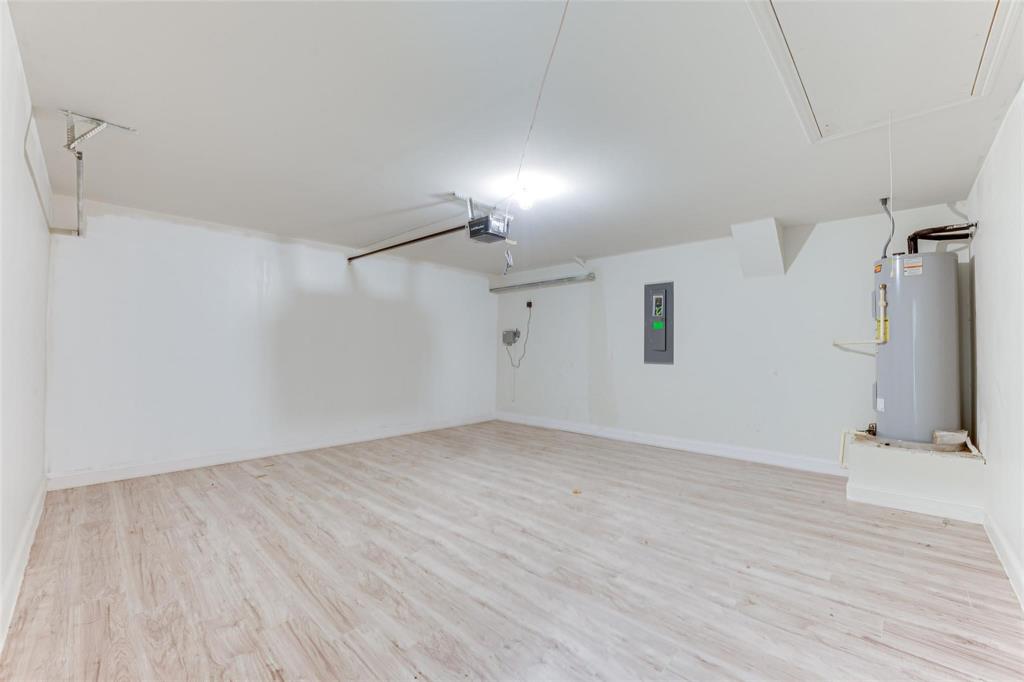 517 Milo Way Royse City, TX 75189 - Photo 17 of 34 Spacious interior with light wood-finish flooring, white walls, and bright overhead lighting