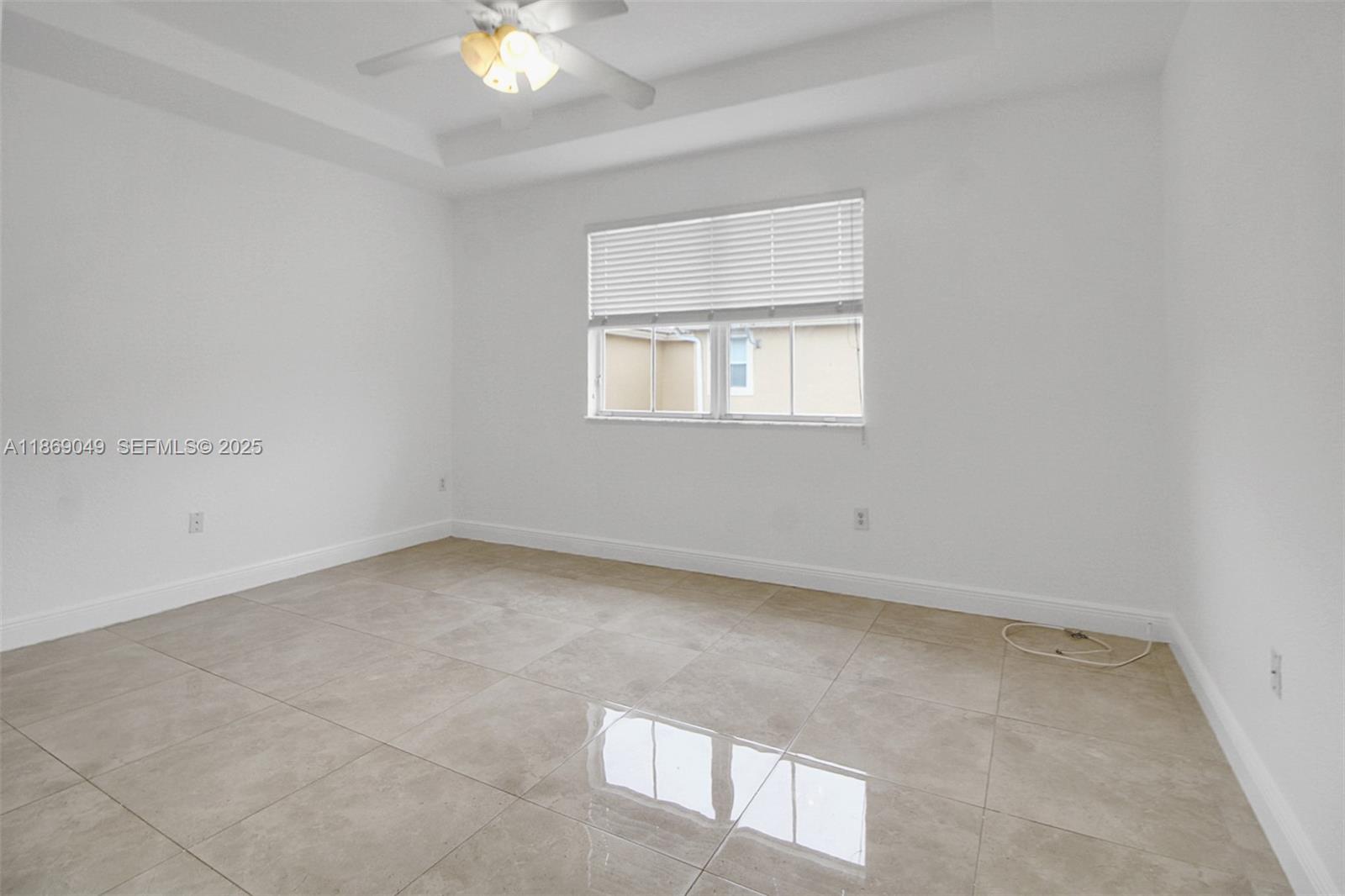 11724 Southwest 137th Path Miami, FL 33186 - Photo 16 of 33 an empty room with a window
