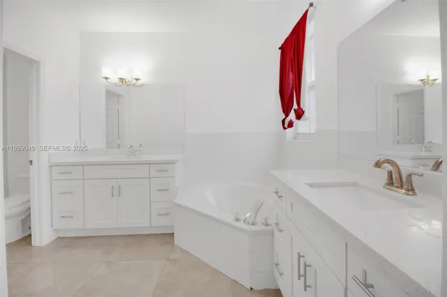 a bathroom with a sink vanity and a mirror