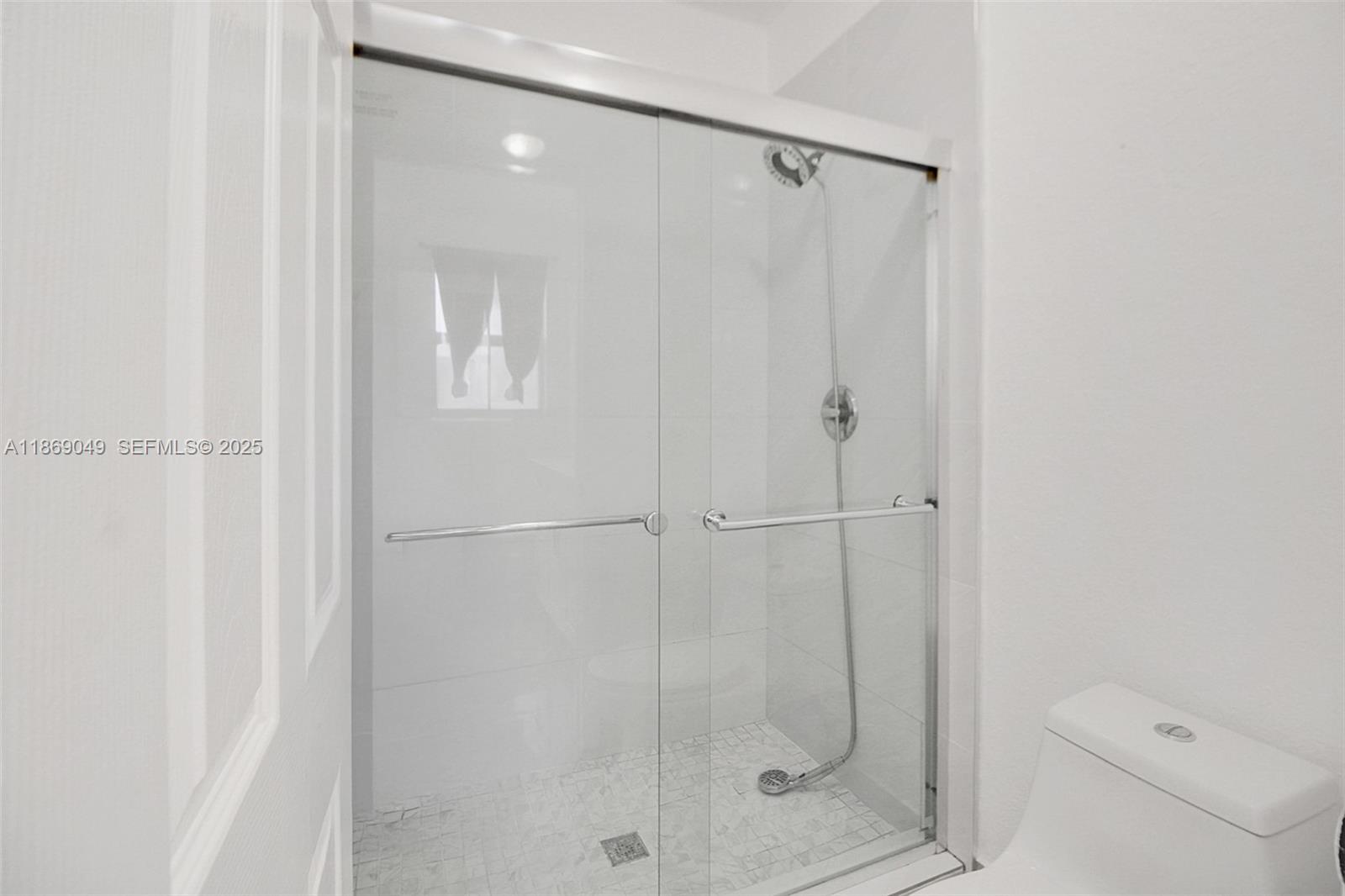 11724 Southwest 137th Path Miami, FL 33186 - Photo 20 of 33 a bathroom with a shower and toilet
