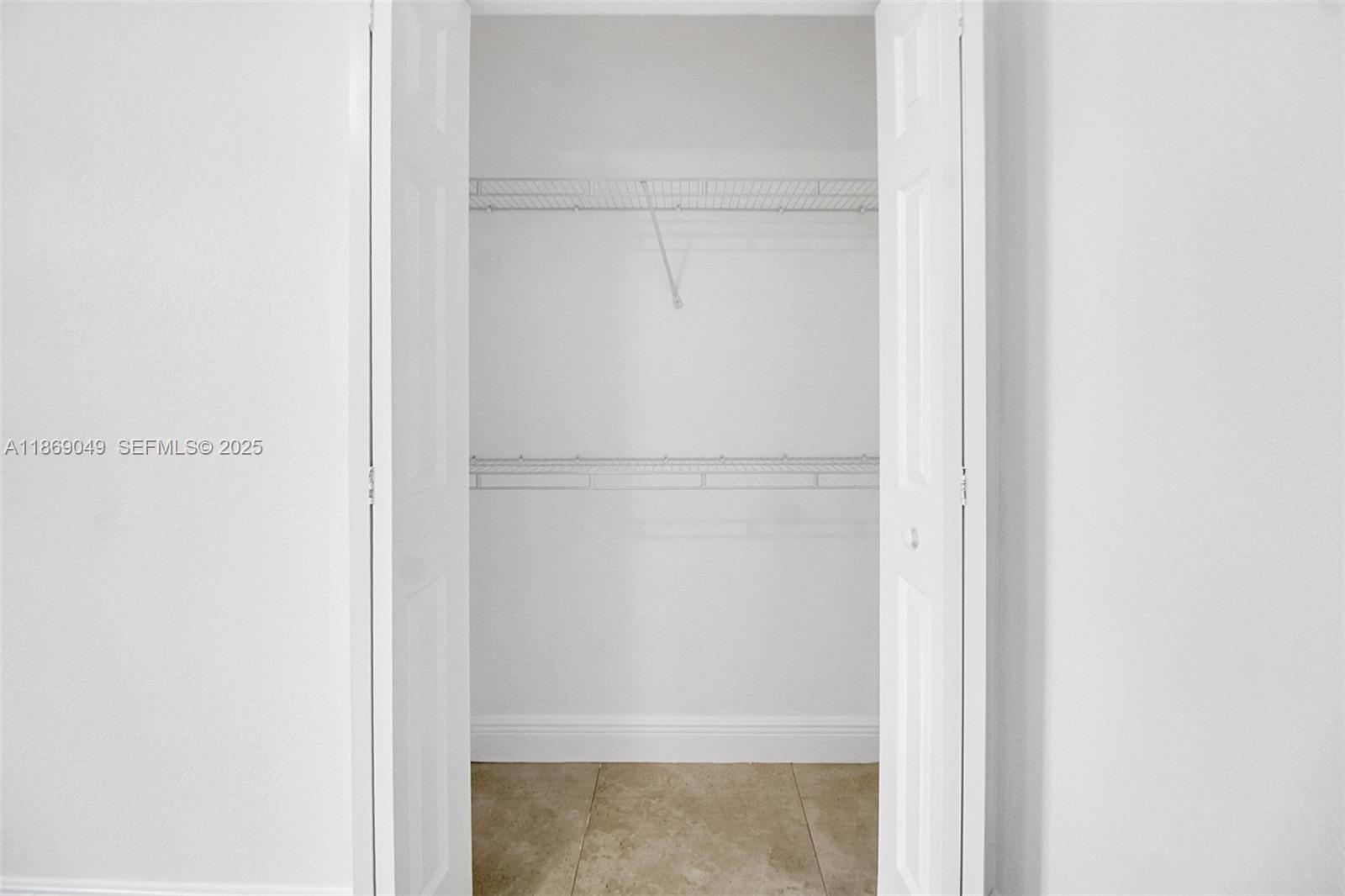 11724 Southwest 137th Path Miami, FL 33186 - Photo 26 of 33 a close view of a closet with wooden floor