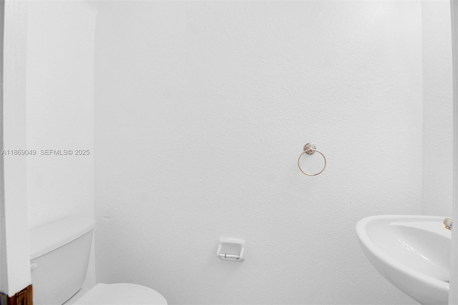 11724 Southwest 137th Path Miami, FL 33186 - Photo 8 of 33 a bathroom with a toilet and sink