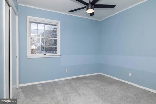 a view of an empty room and wooden floor