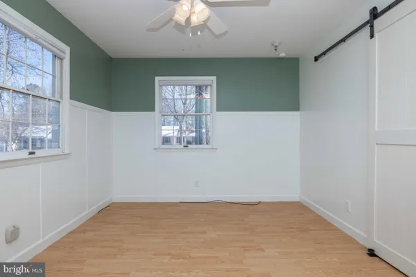 a large kitchen with stainless steel appliances granite countertop a stove a sink and a refrigerator
