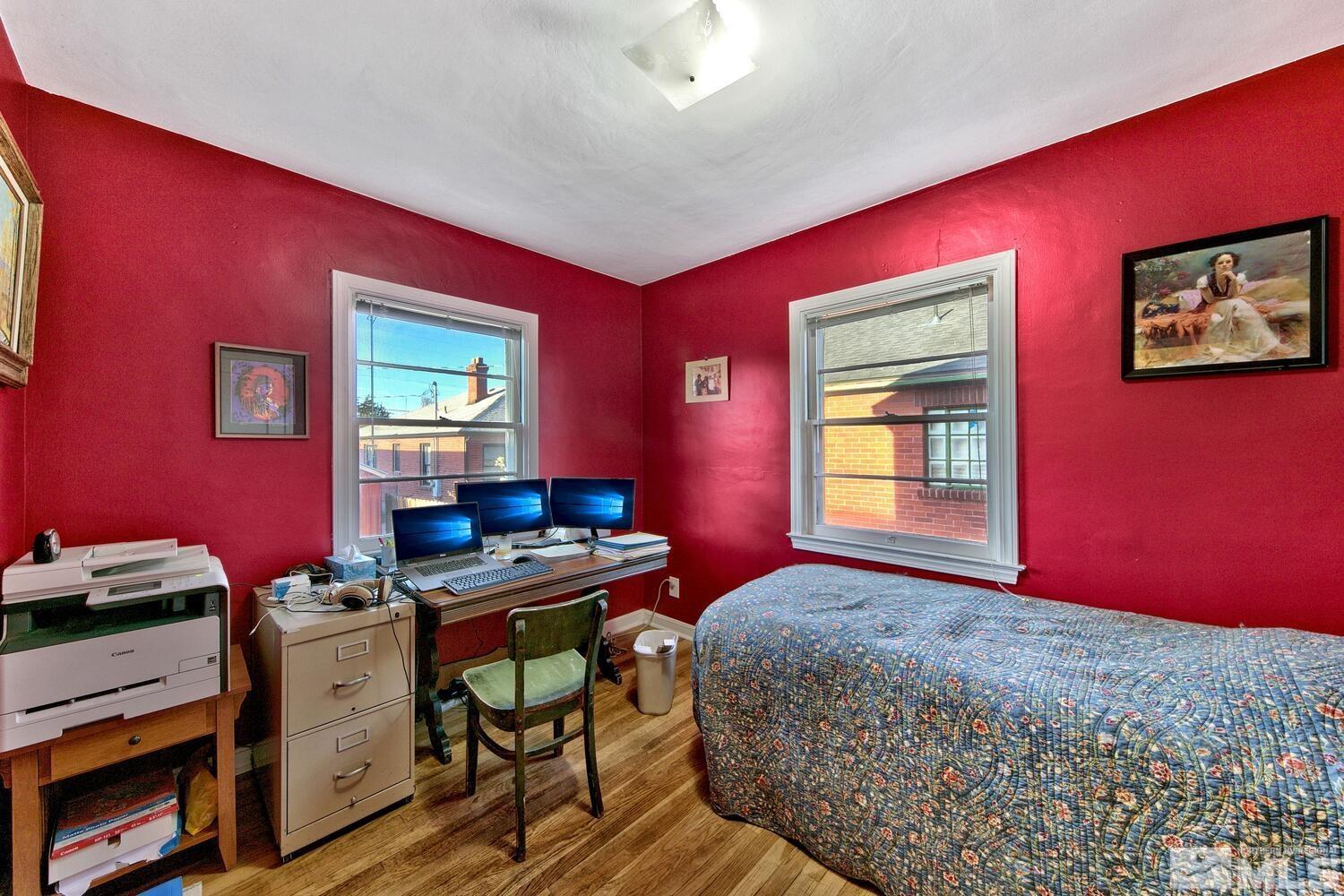 561 Moran Street Reno, NV 89502 - Photo 11 of 40 a bedroom with a bed and a workspace