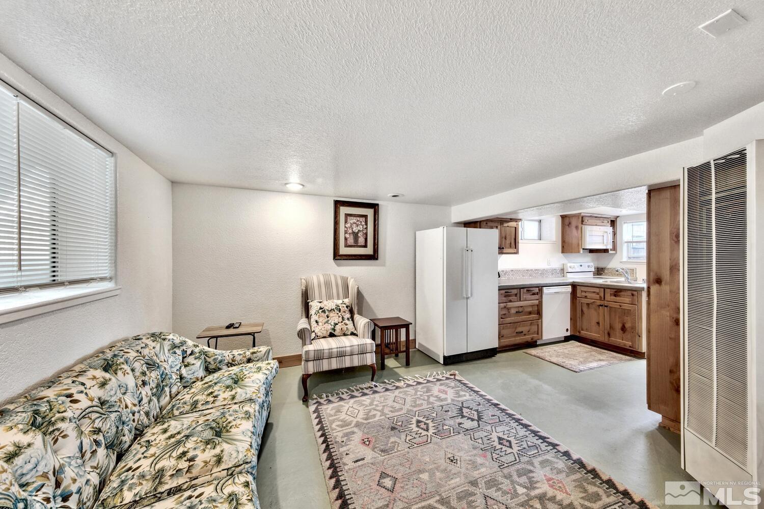 561 Moran Street Reno, NV 89502 - Photo 19 of 40 a bedroom with furniture and a rug